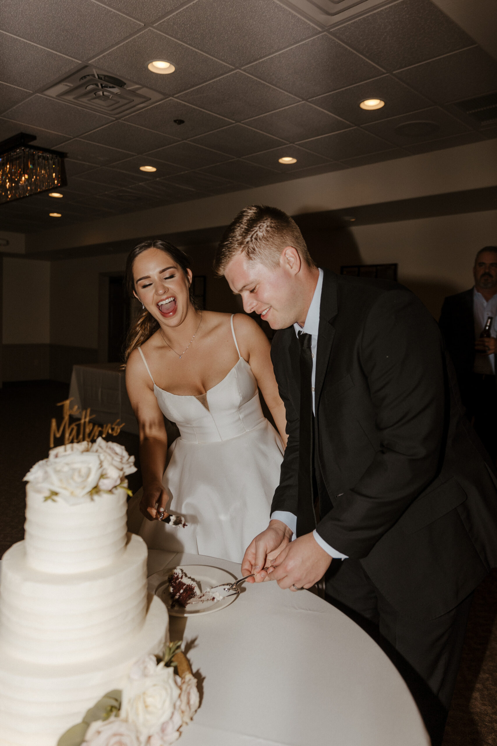 bride and groom cutting cake at wedding in Sedona Arizona
