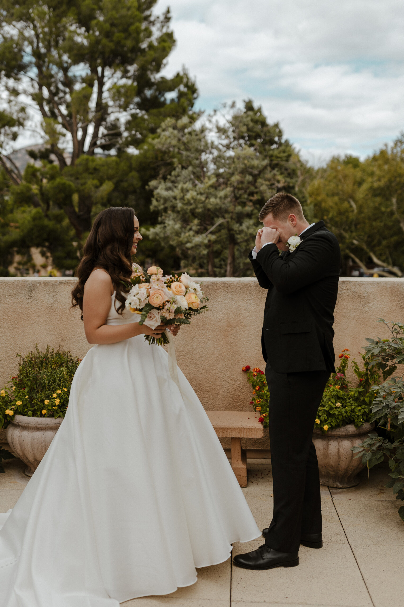 emotional bride and groom first look 