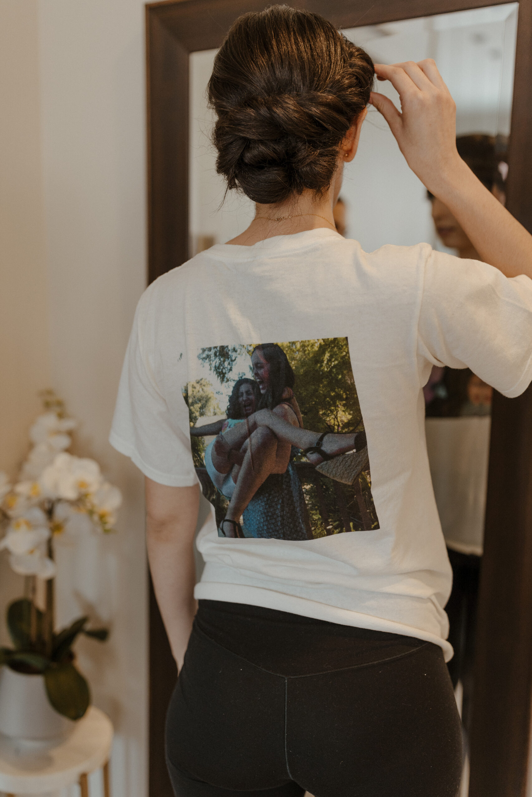 bridesmaid with getting ready shirt. on