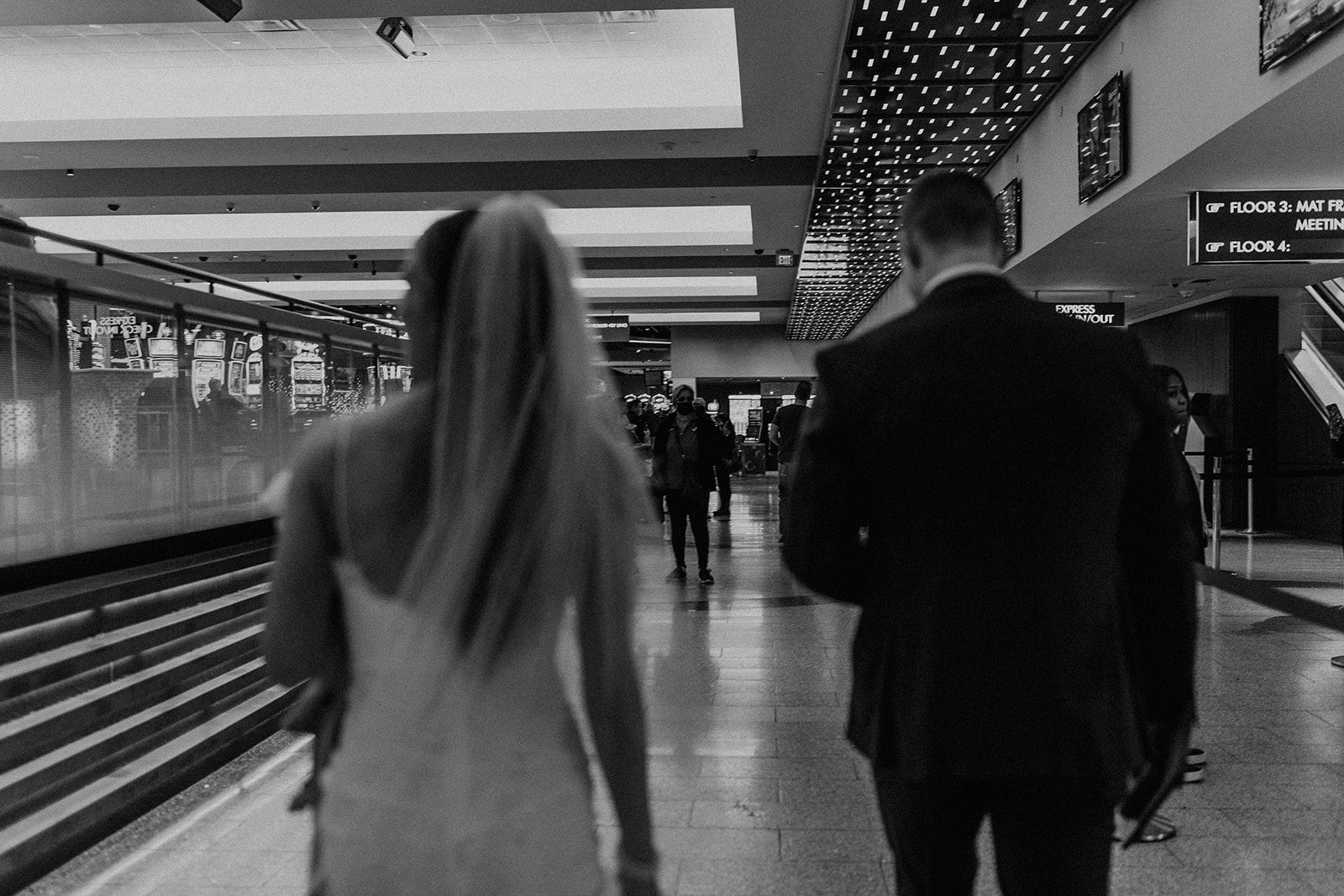 black and white of bridal couple walking