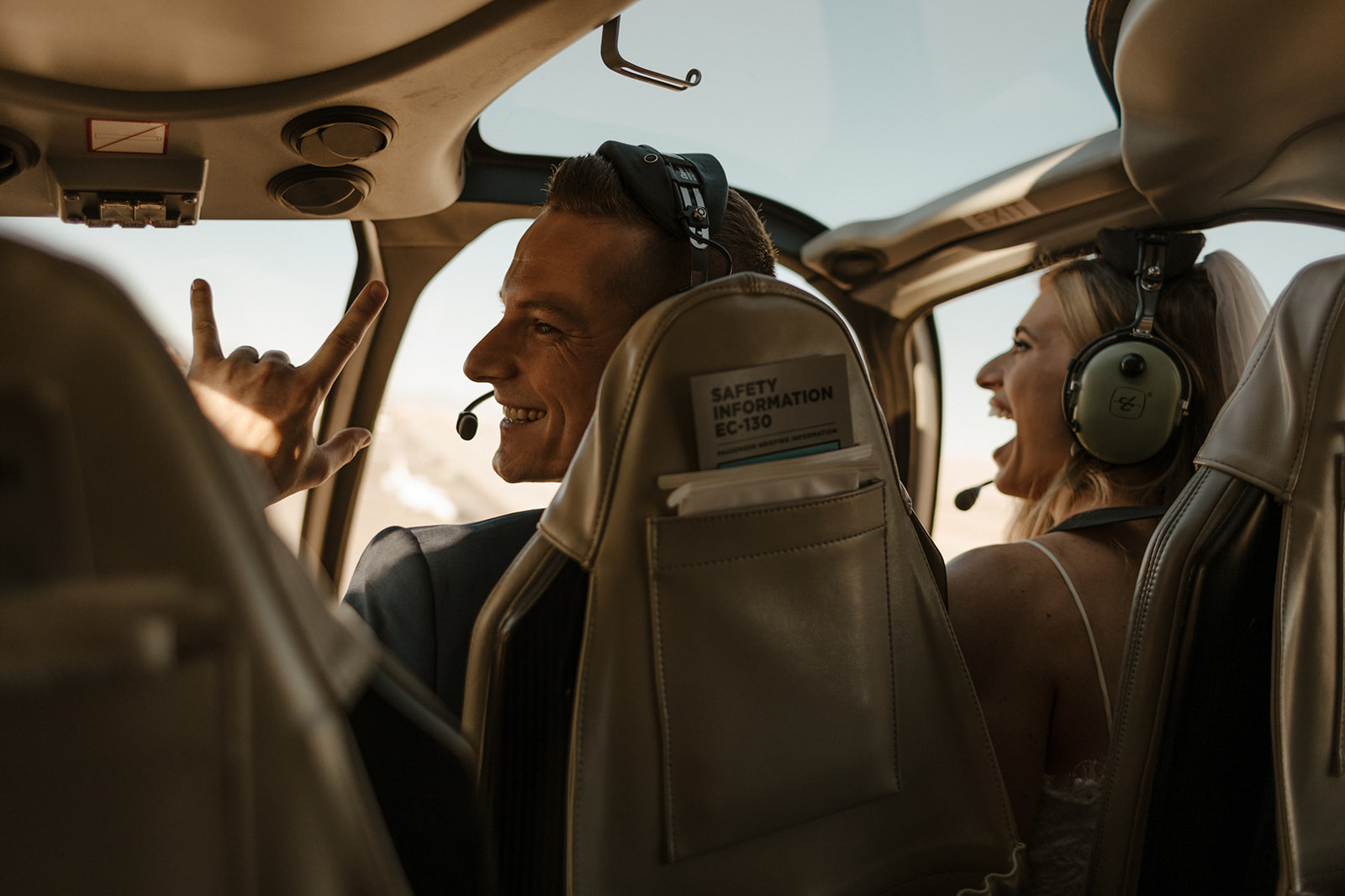 bridal couple in flying in the helicopter