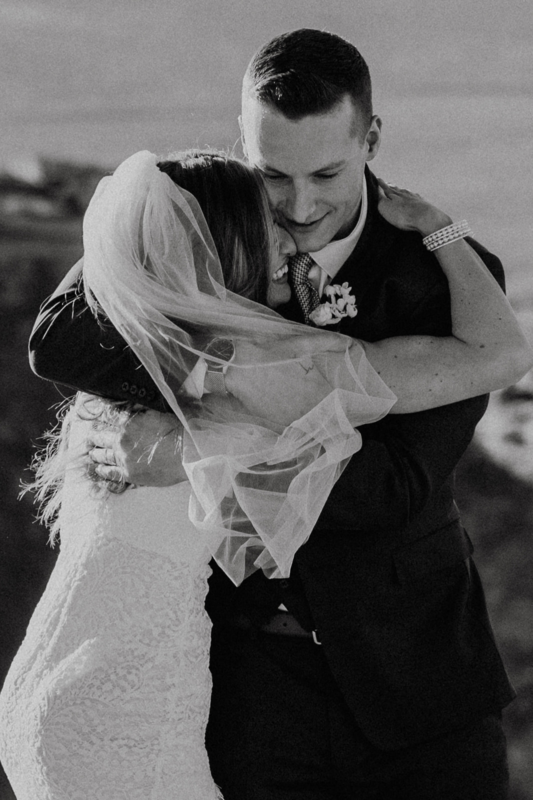 black and white bridal couple hugging