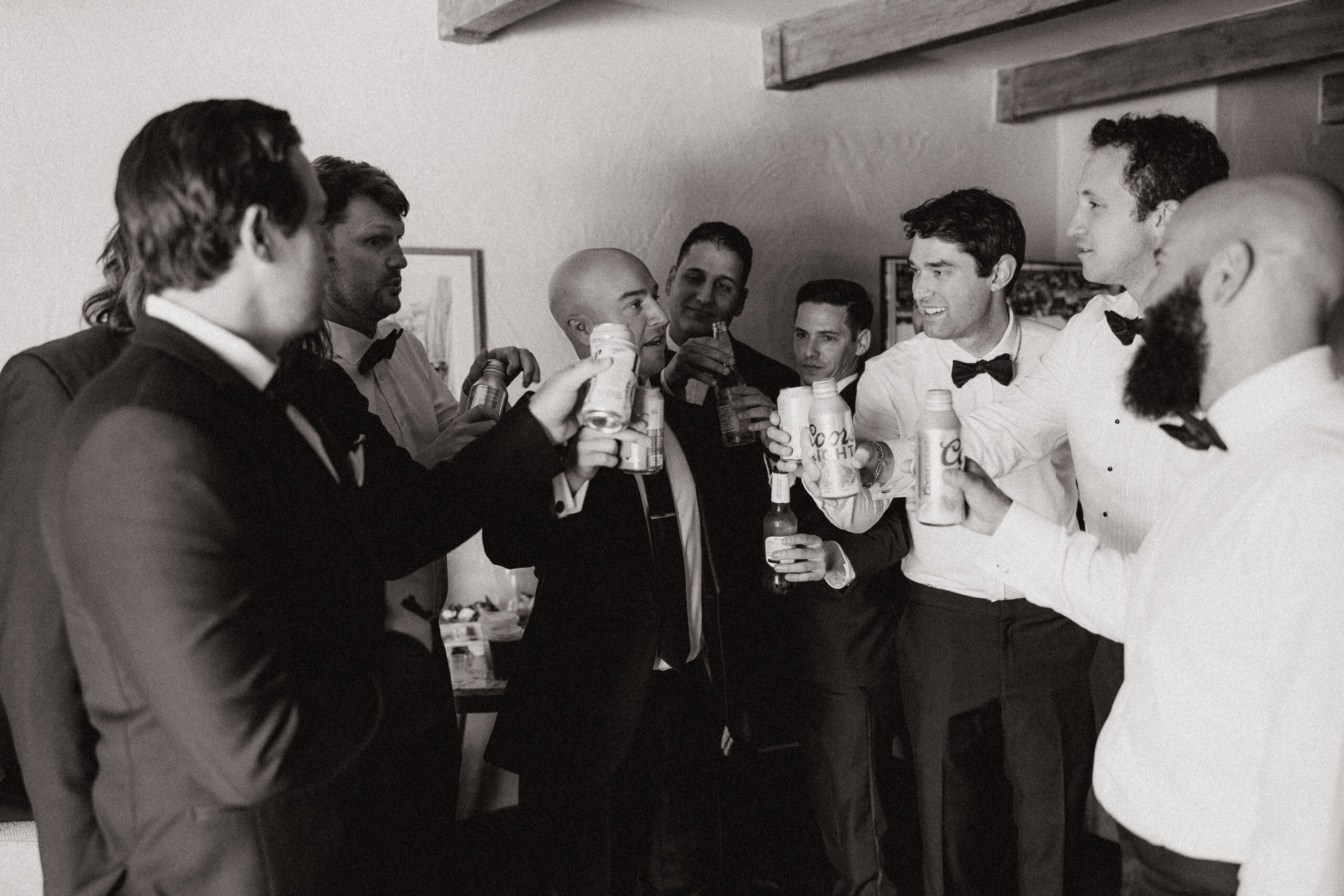 groom and groomsmen toasting 