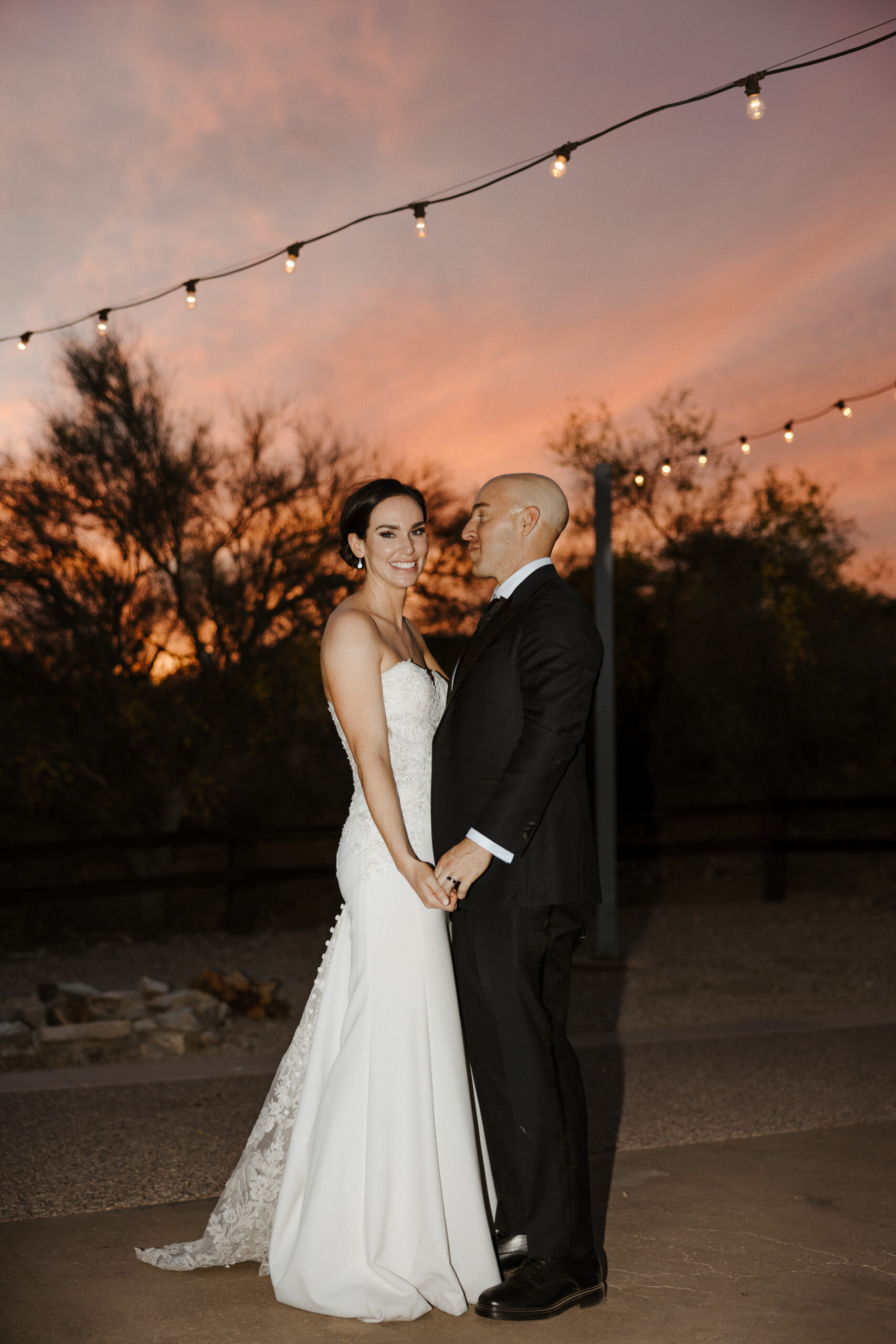 bride and groom with sunset 