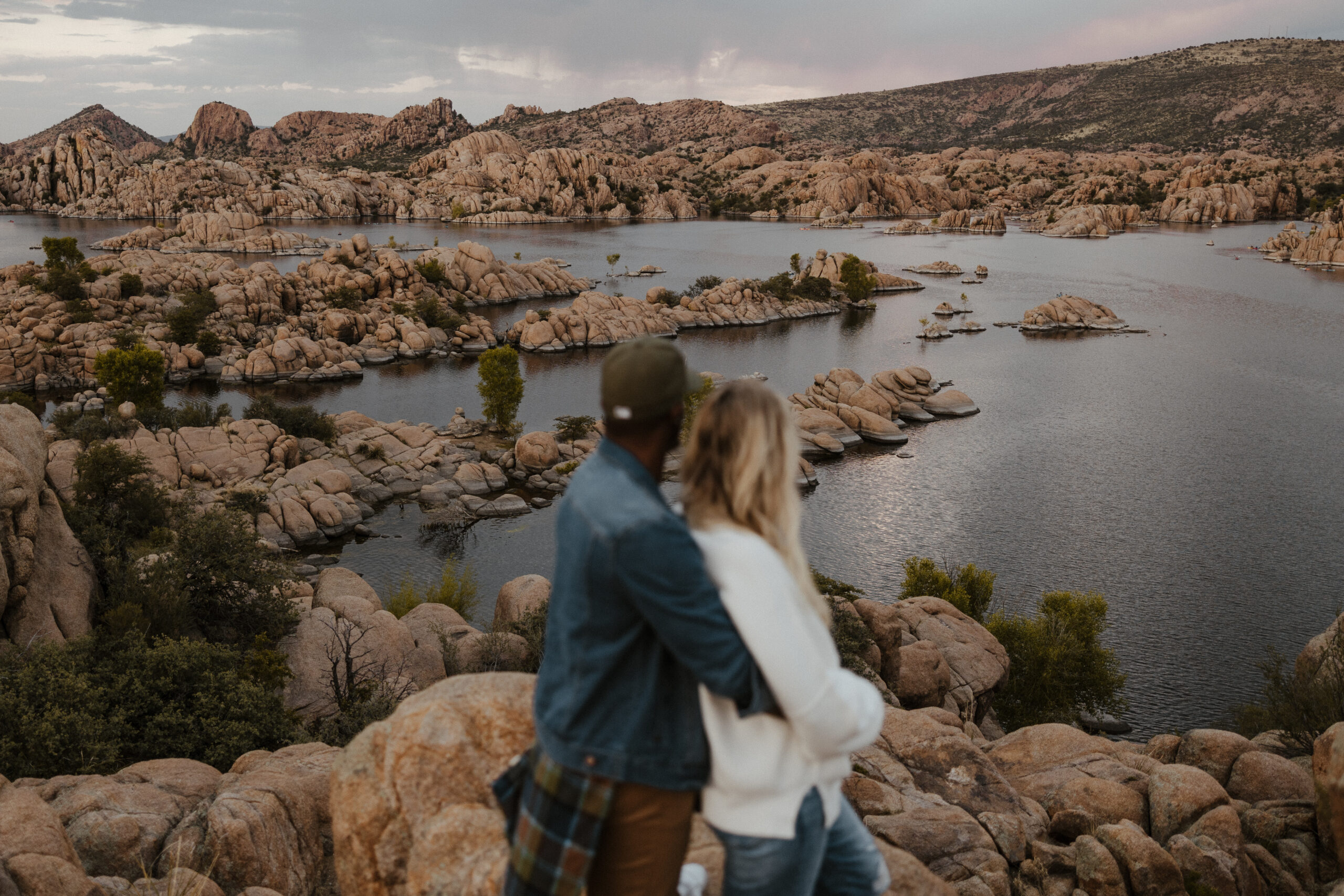 couple blurred at watson lake in Arizona with scenery in focus