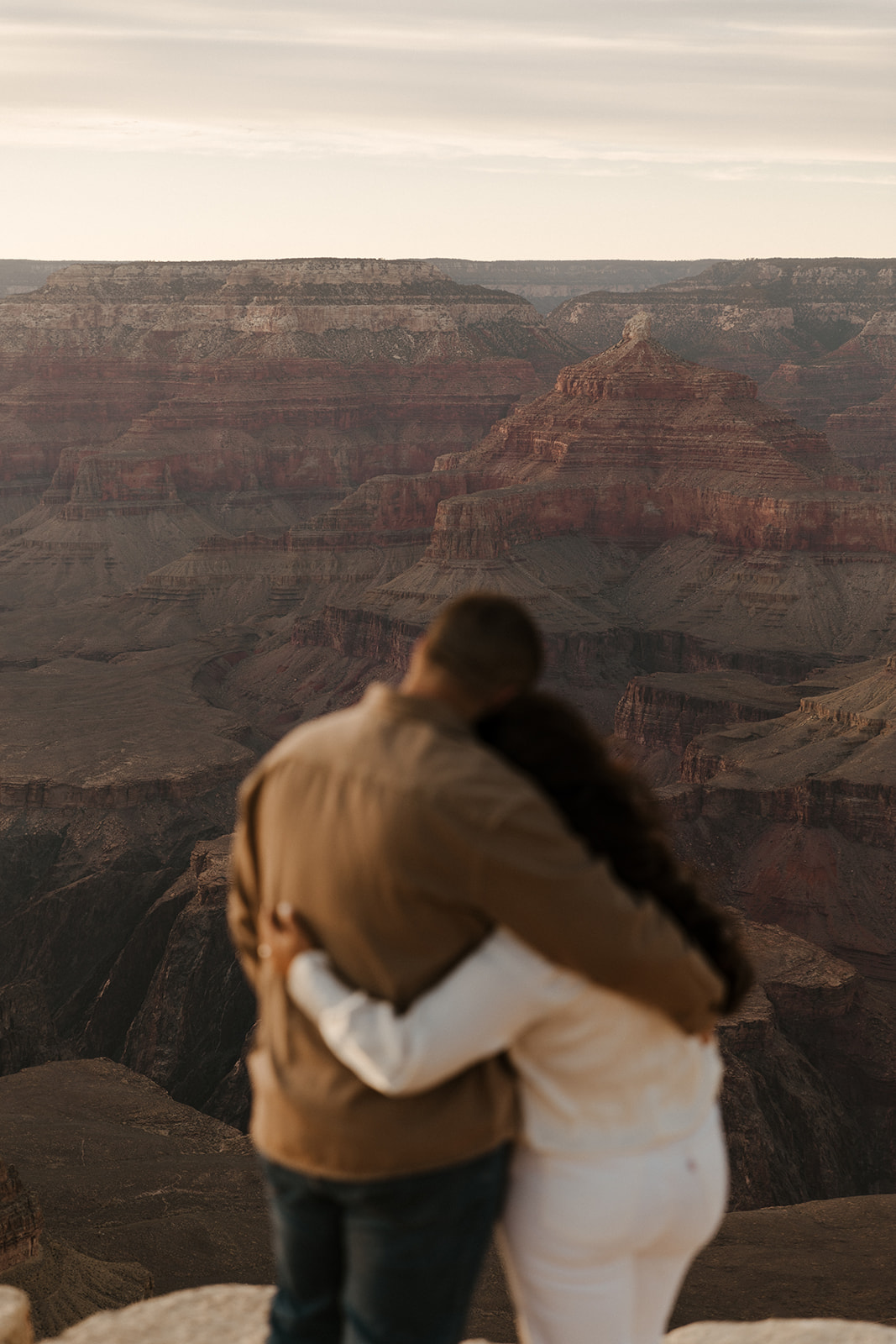 blurred couple with Grand Canyon in background