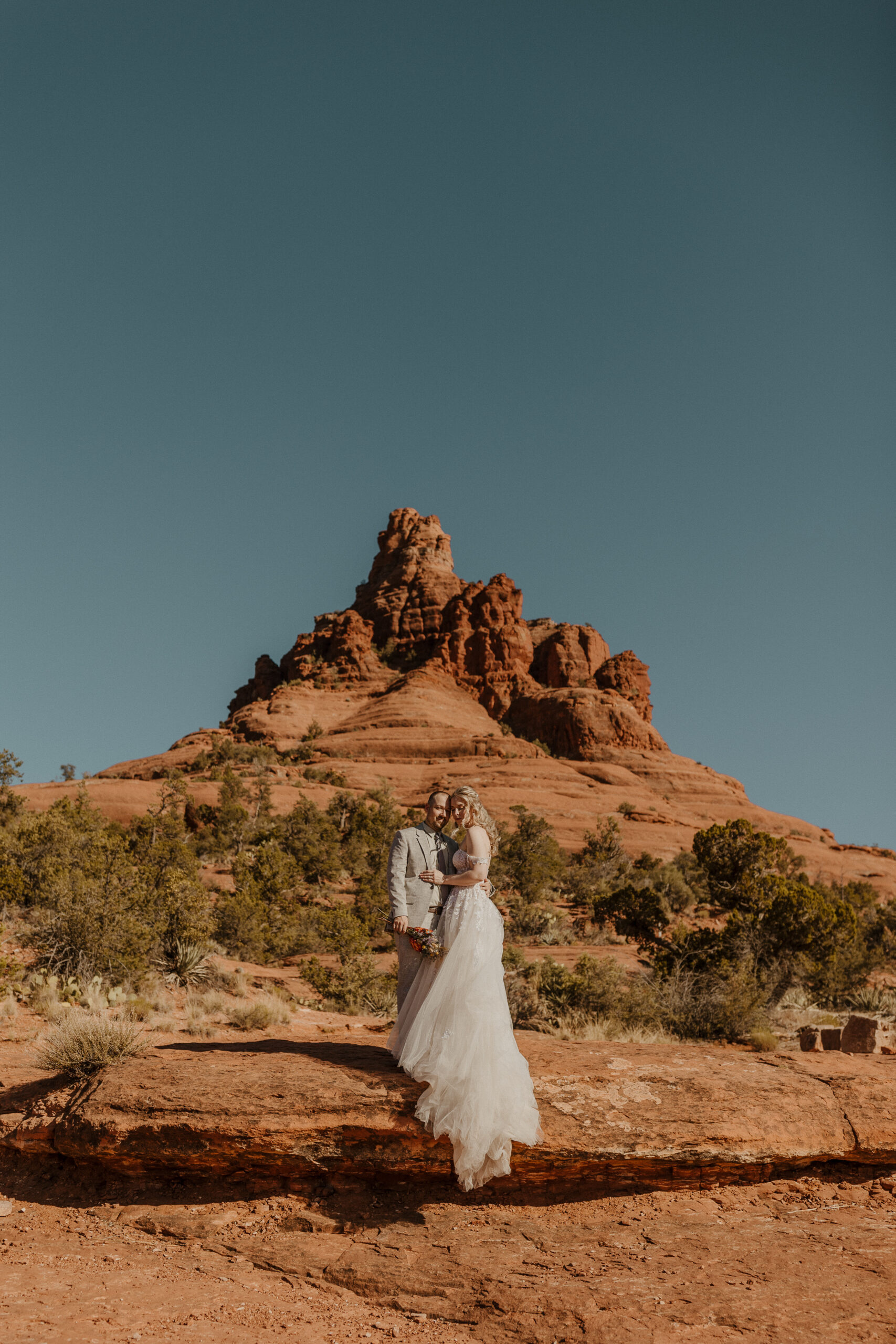 sedona elopement bride and groom portrait with red rocks in the background 
