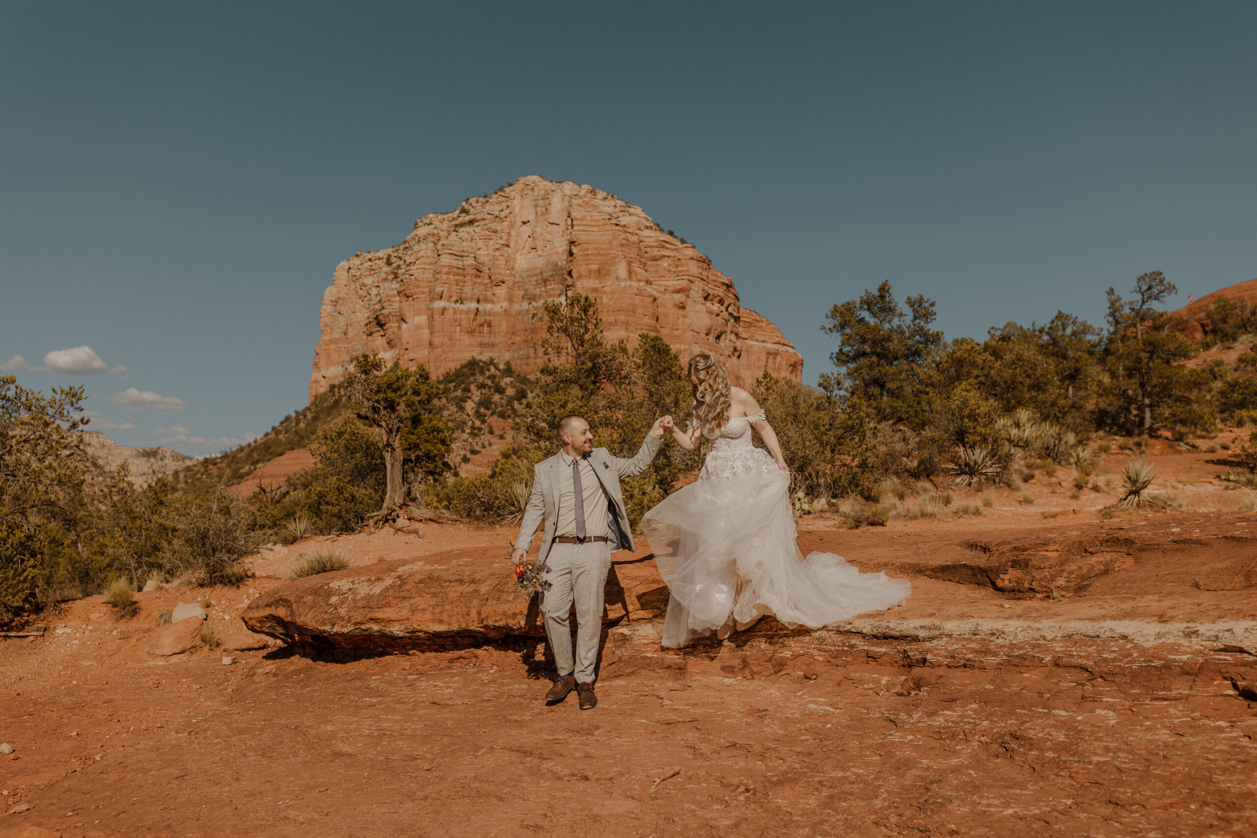 sedona elopement bride and groom portrait with red rocks in the background 