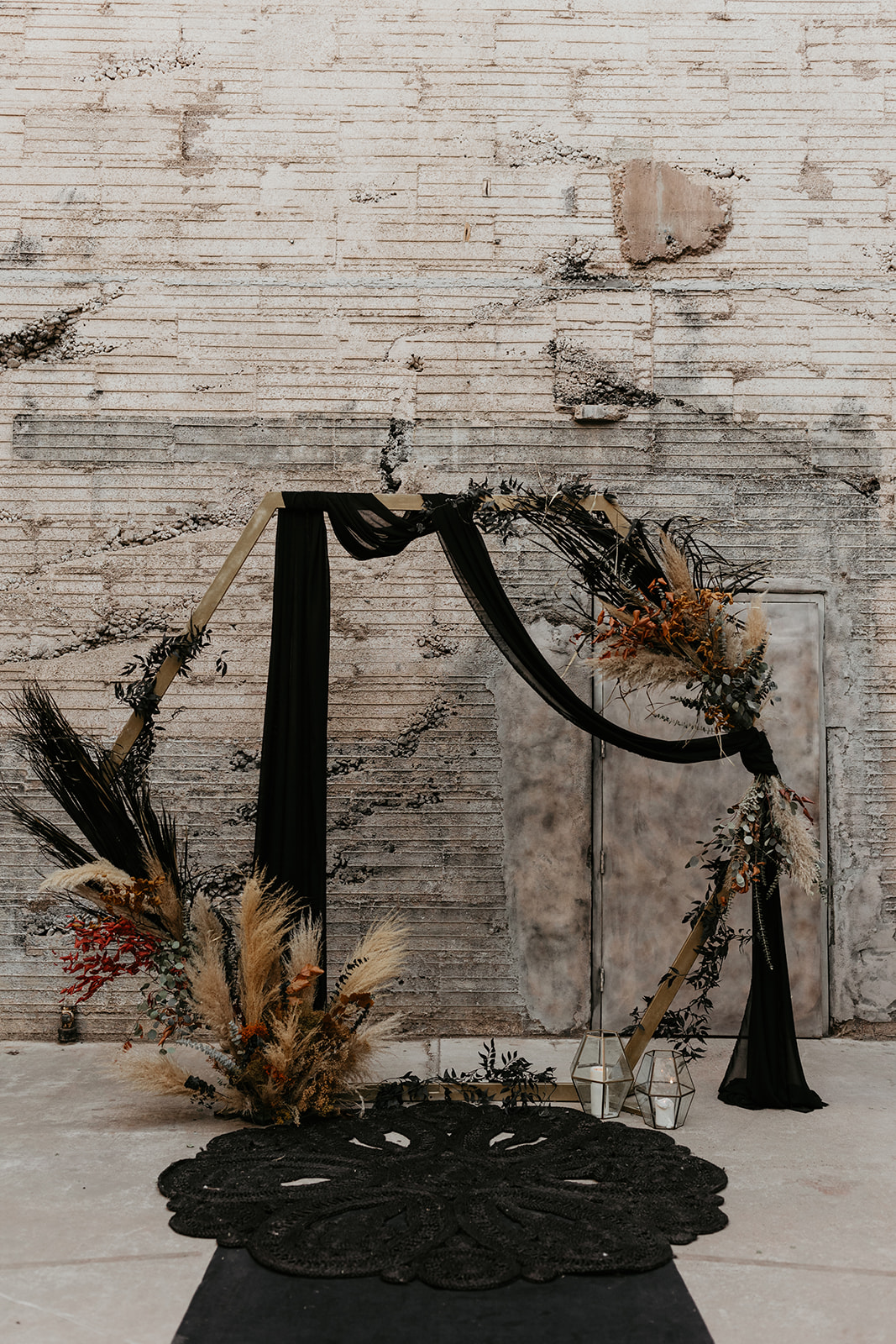 romantic and moody dried floral altar at fall halloween wedding 