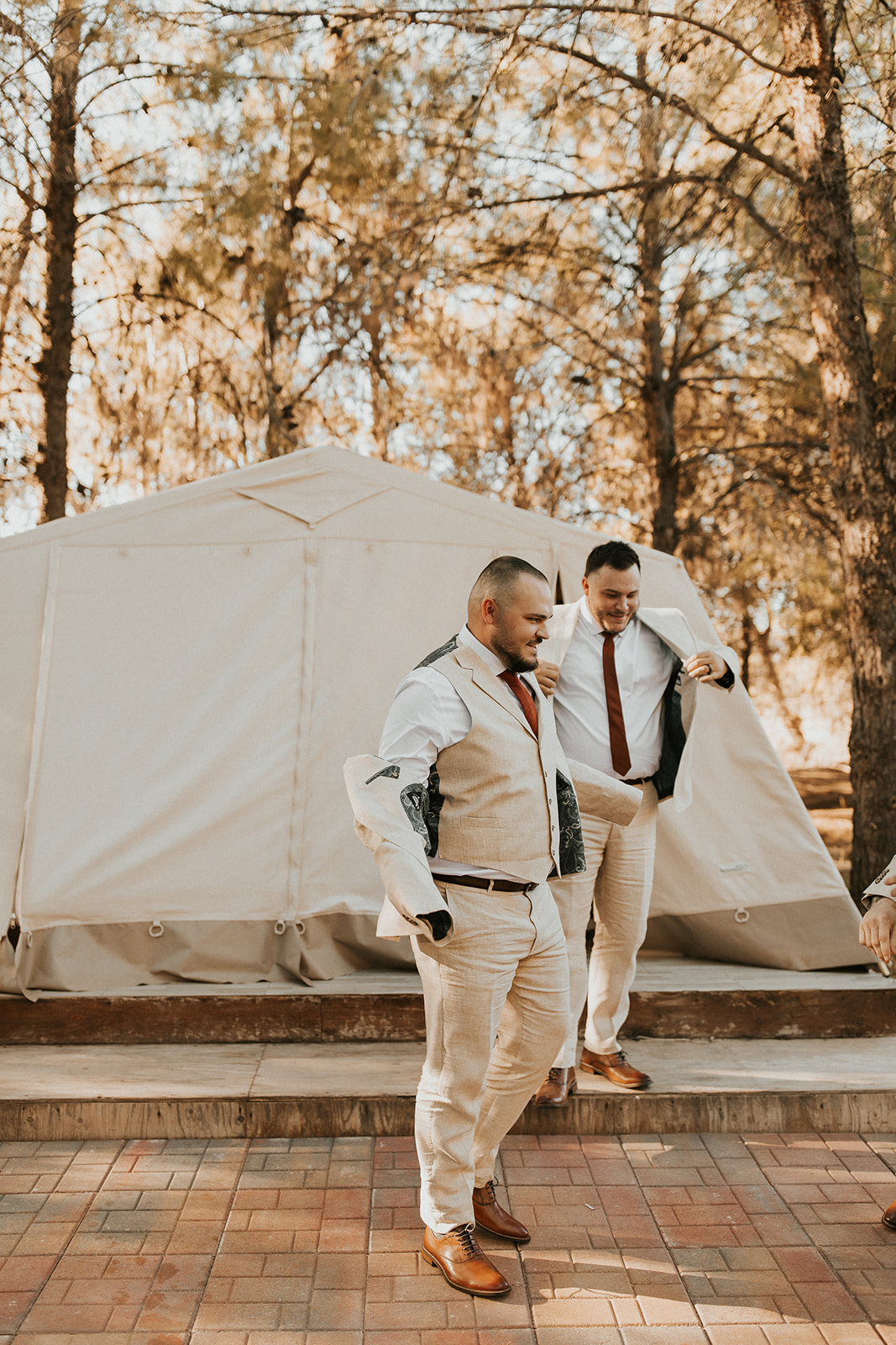 groom getting ready in tent at one of Arizona's forest wedding venues