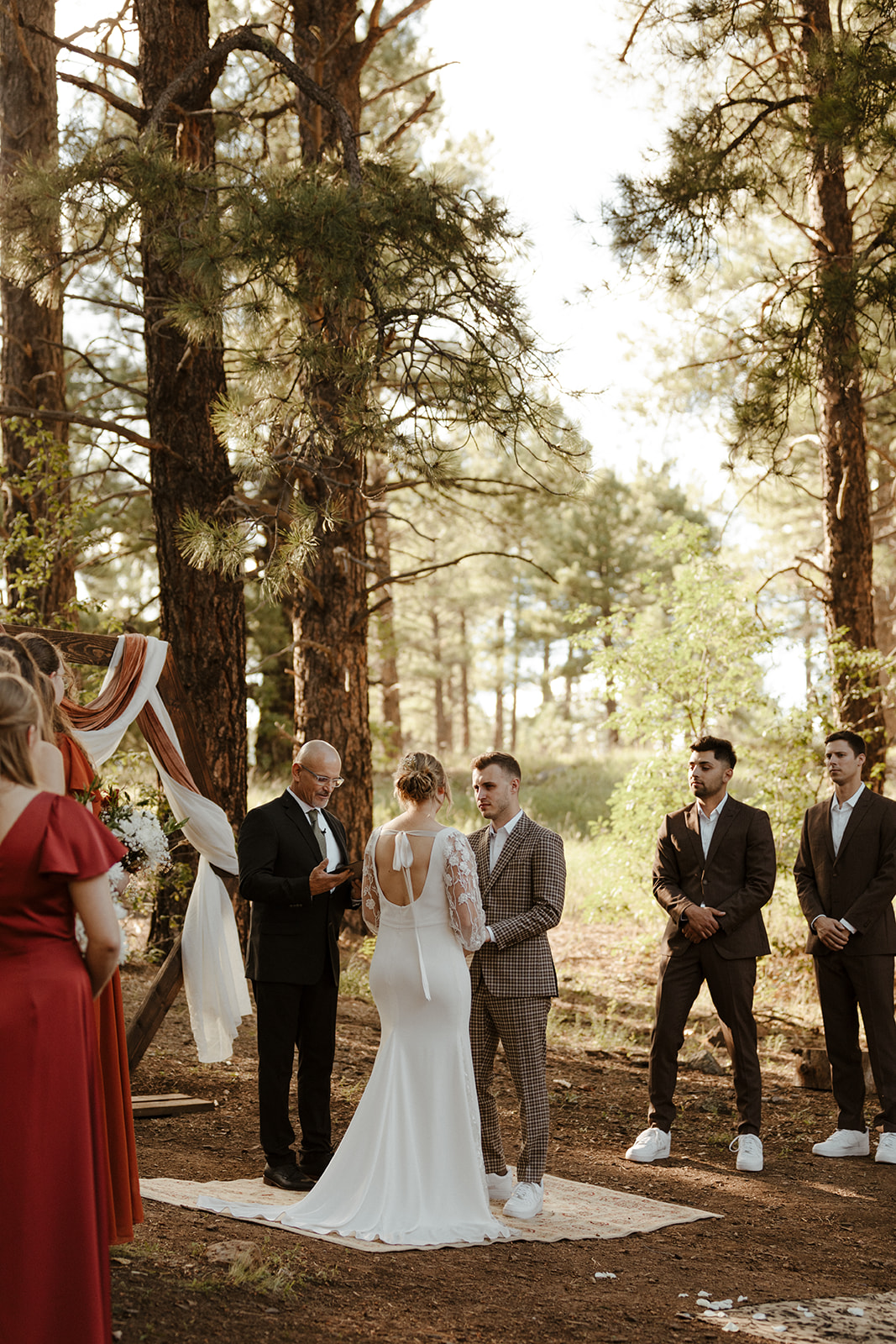 bridal couple during ceremony at the altar at one of Arizona's forest wedding venues