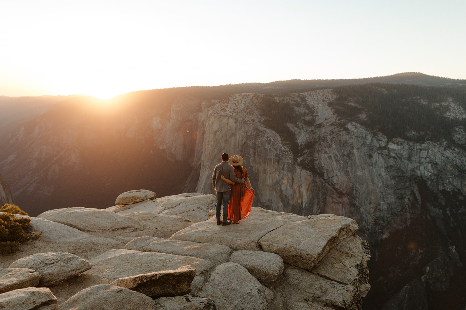 couple looking out at the views on taft point in yosemite park