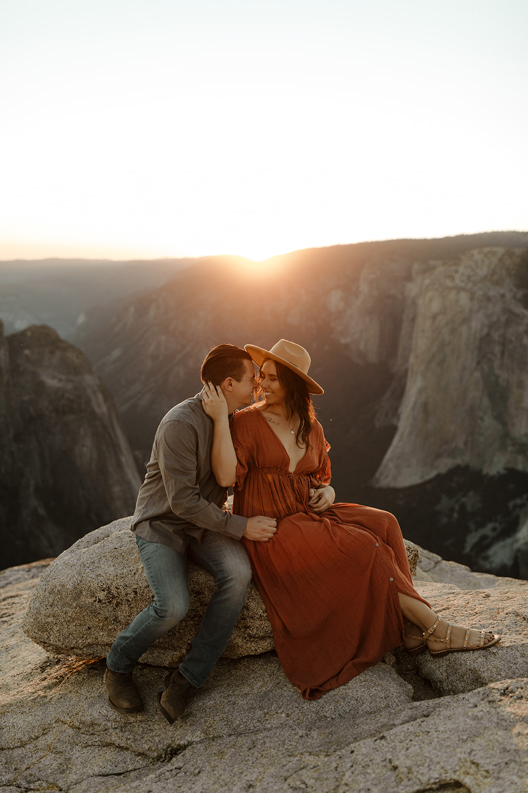 couple sitting and holding each other on taft point 