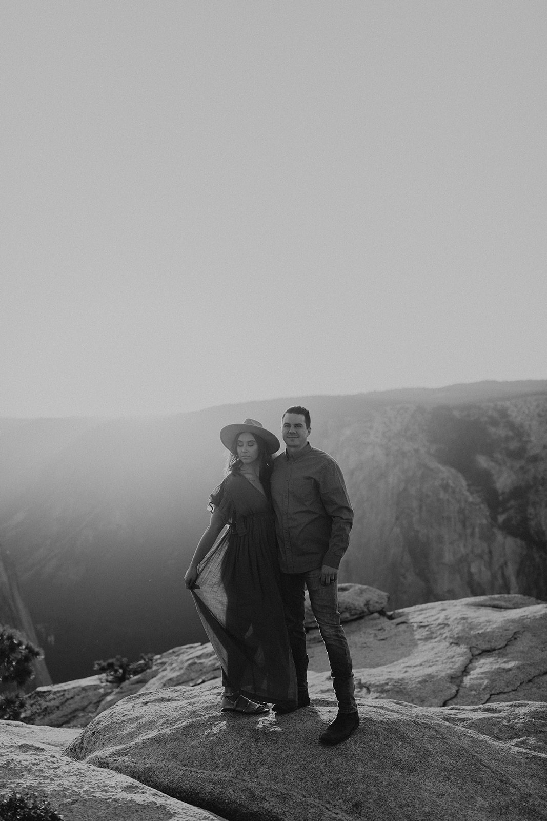 couple standing on taft point in yosemite park