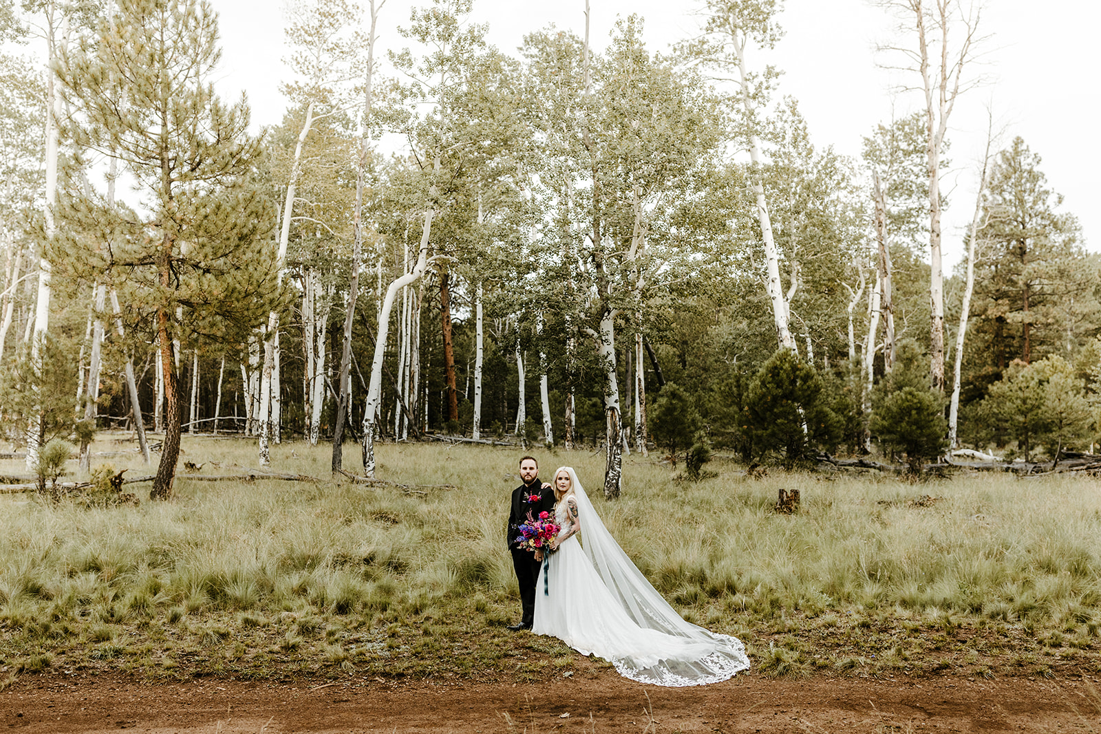 bridal couple portrait in the woods at one of Arizona's forest wedding venues