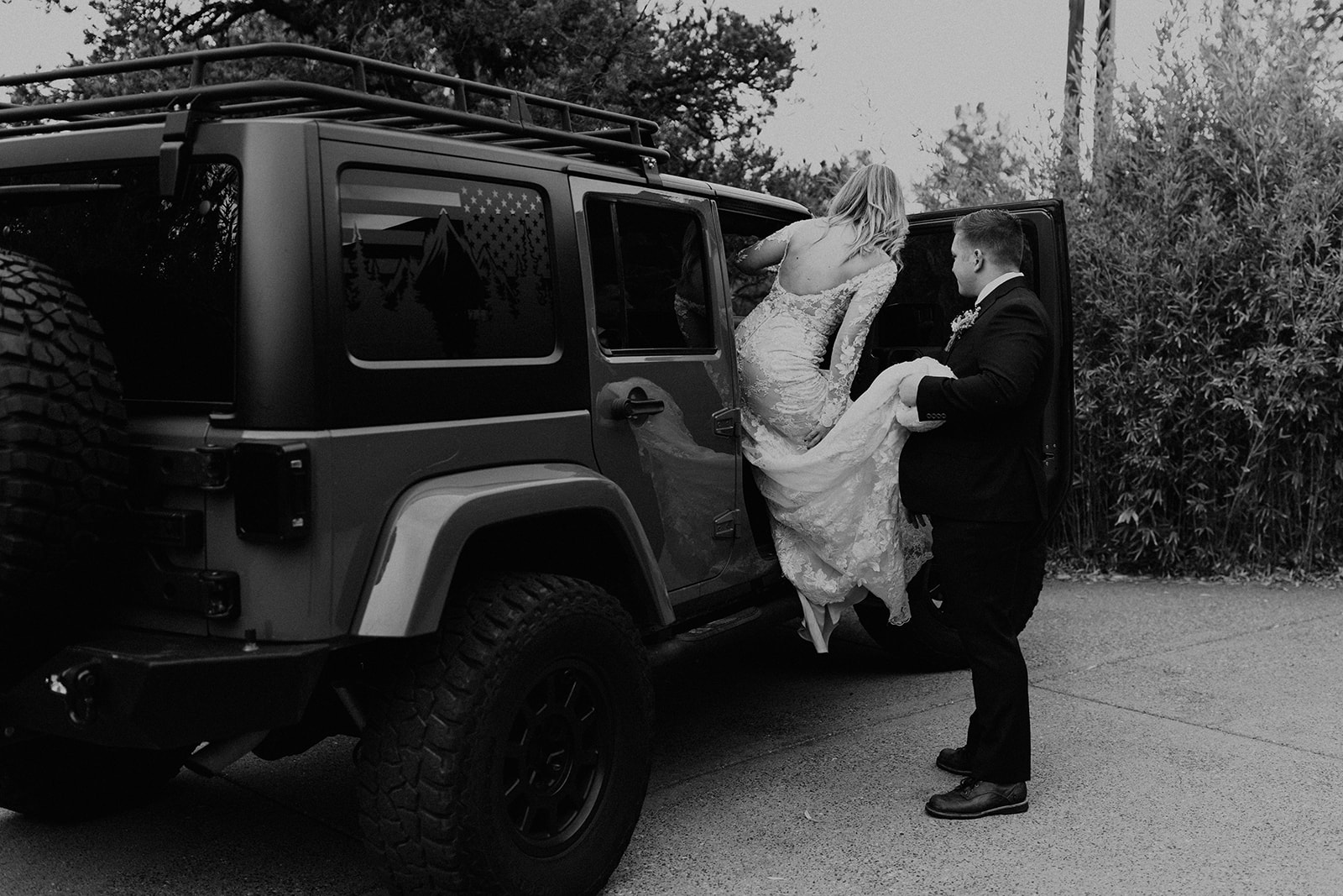 groom helping bride into their jeep to go to the ceremony at sedona elopement wedding 