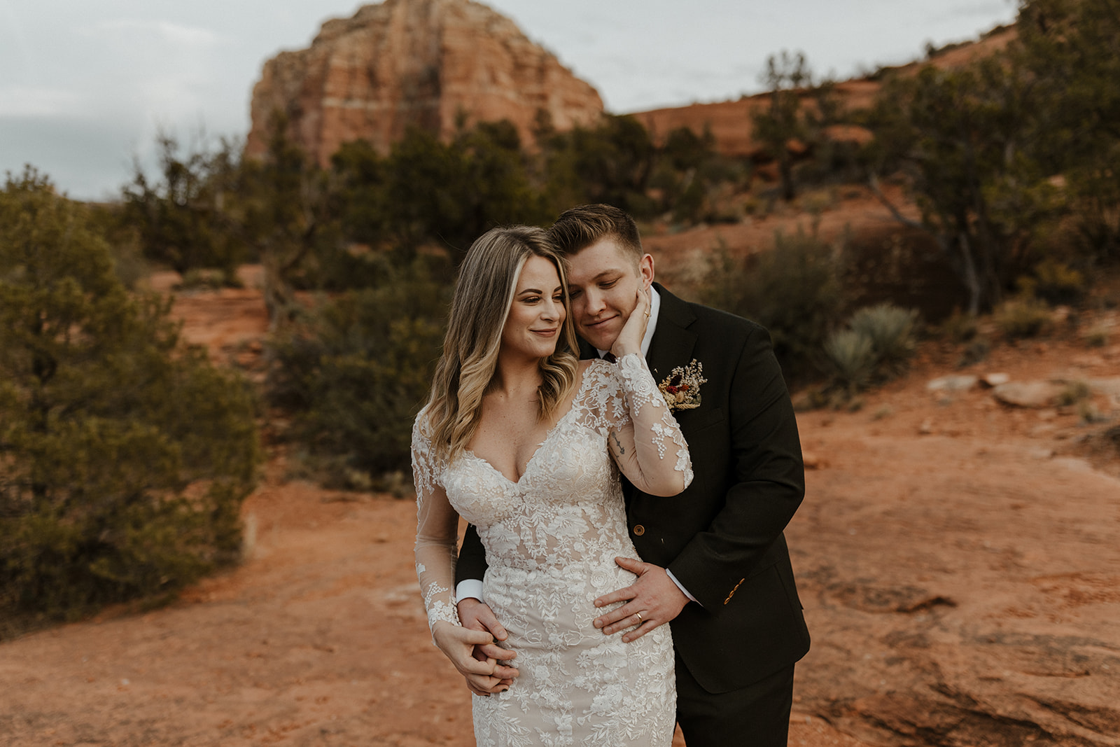 bridal couple holding each other at sedona elopement wedding 