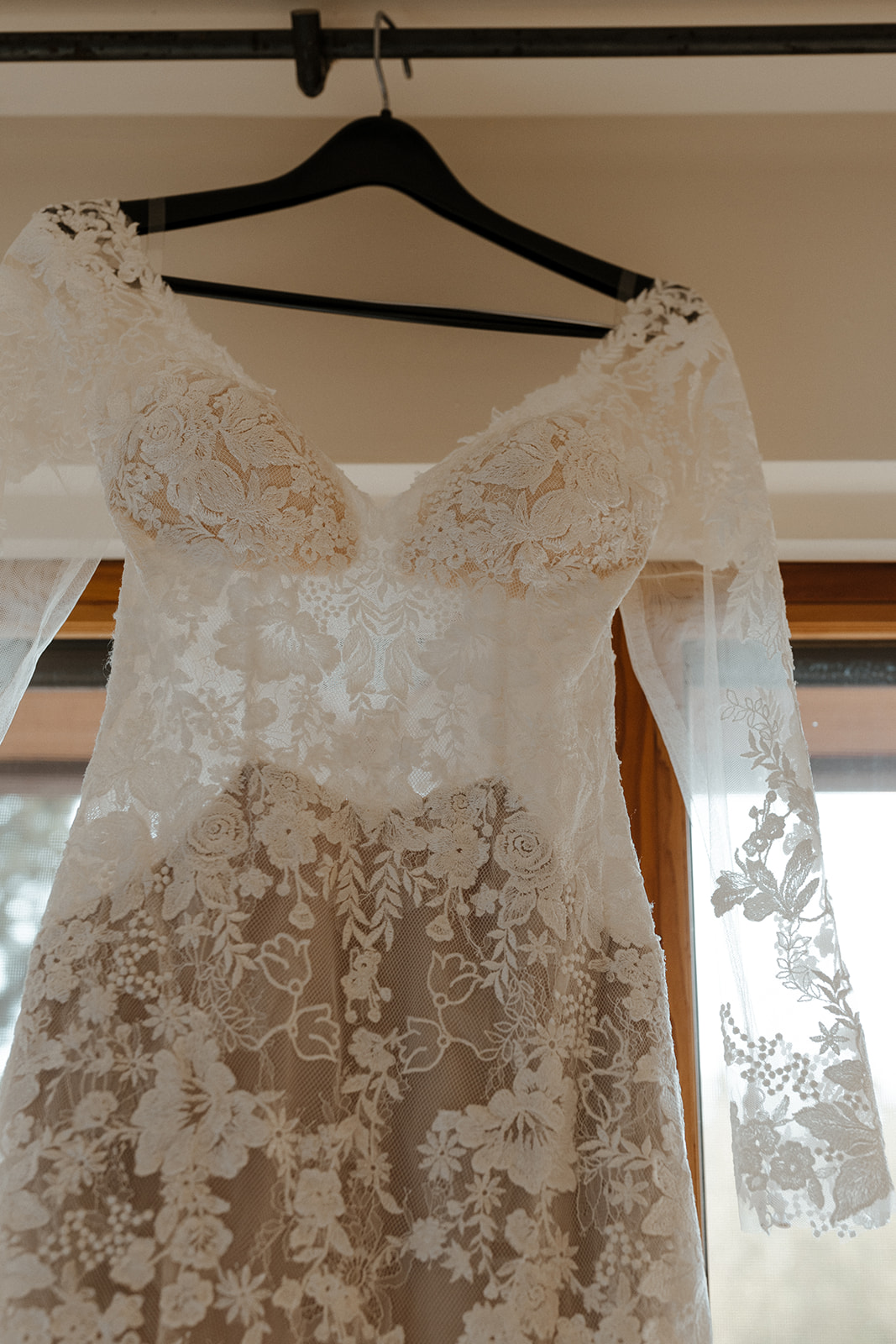 close up of bride's dress hanging