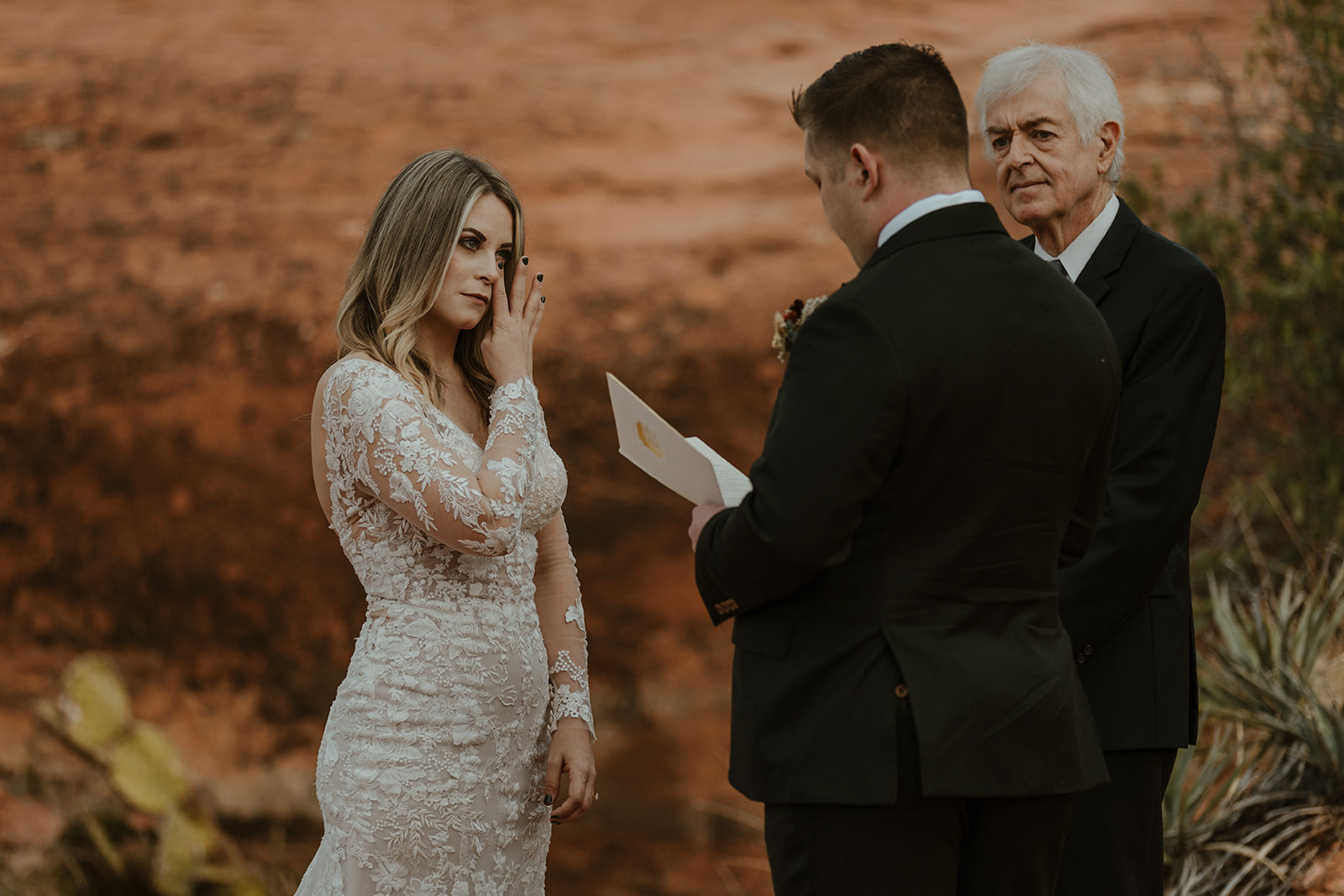 bride tearing up during ceremony at sedona elopement wedding 