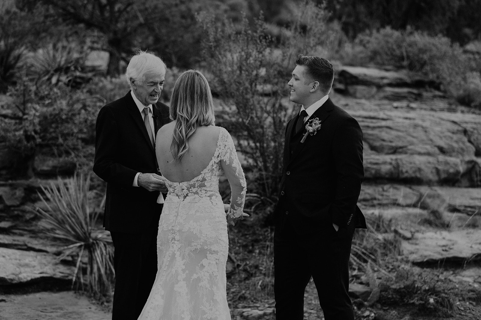 black and white candid of bridal couple at their wedding ceremony at Bell Rock 