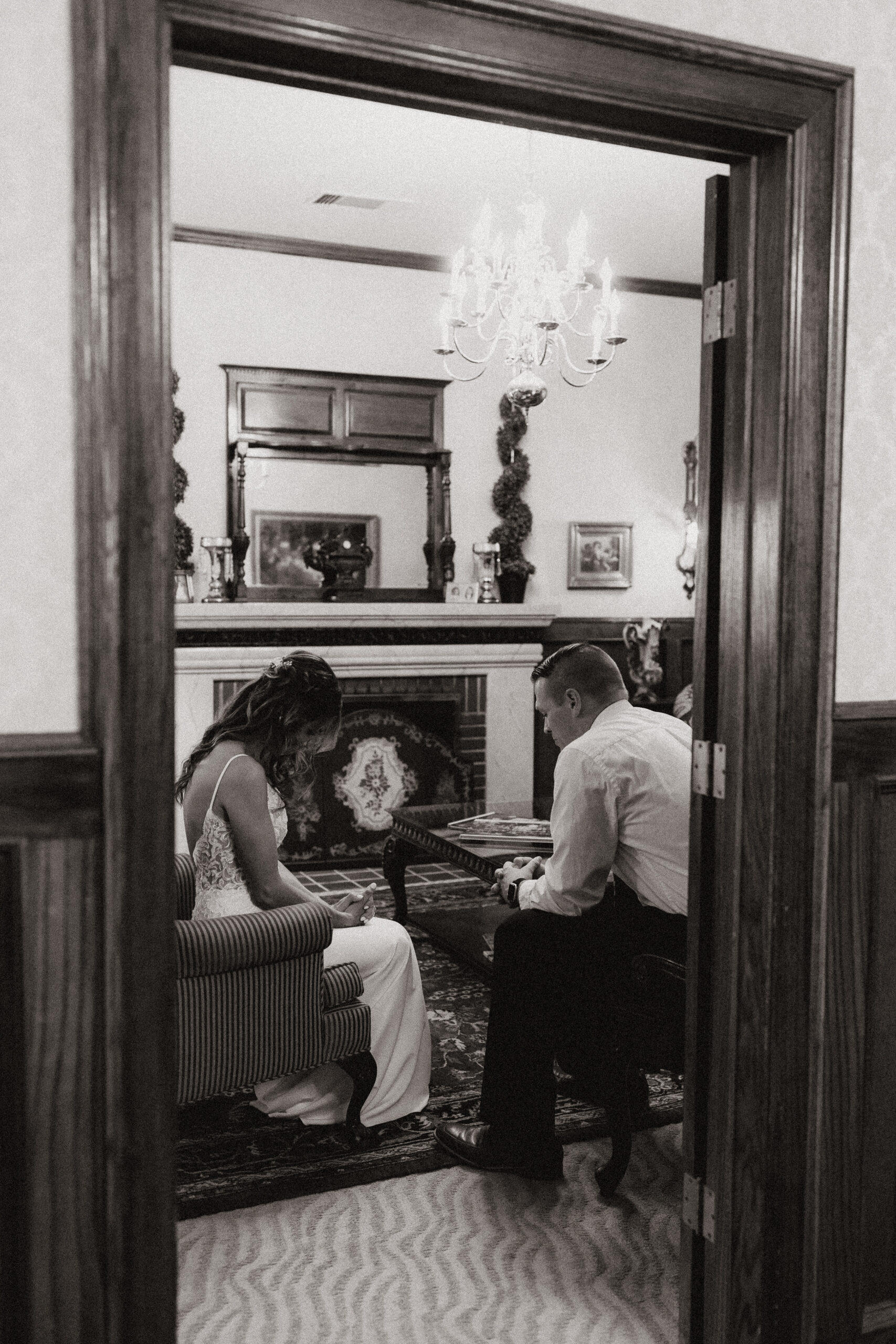 bride and officiant through a doorway 
