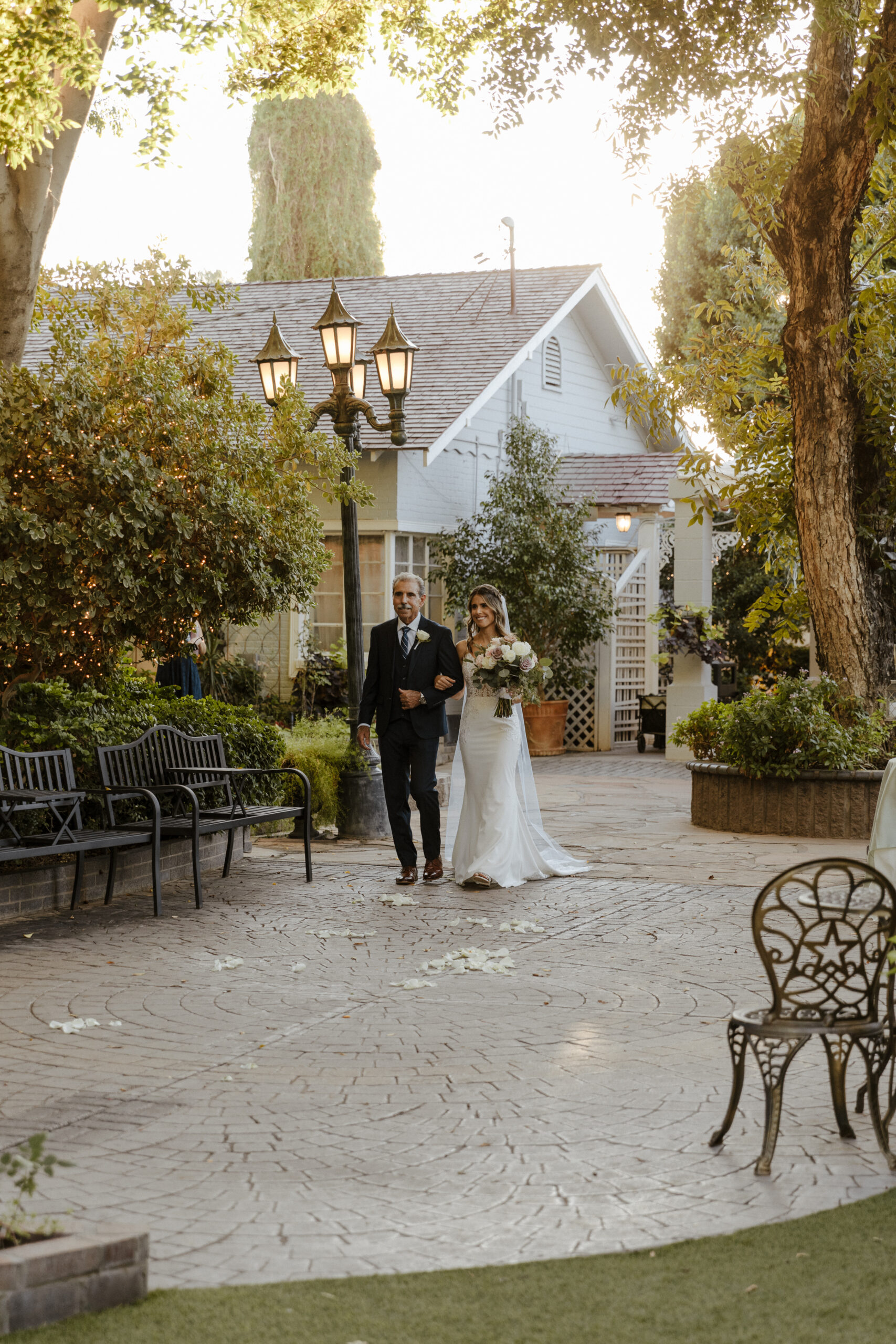 bride and her father walking down the aisle at garden wedding in arizona 