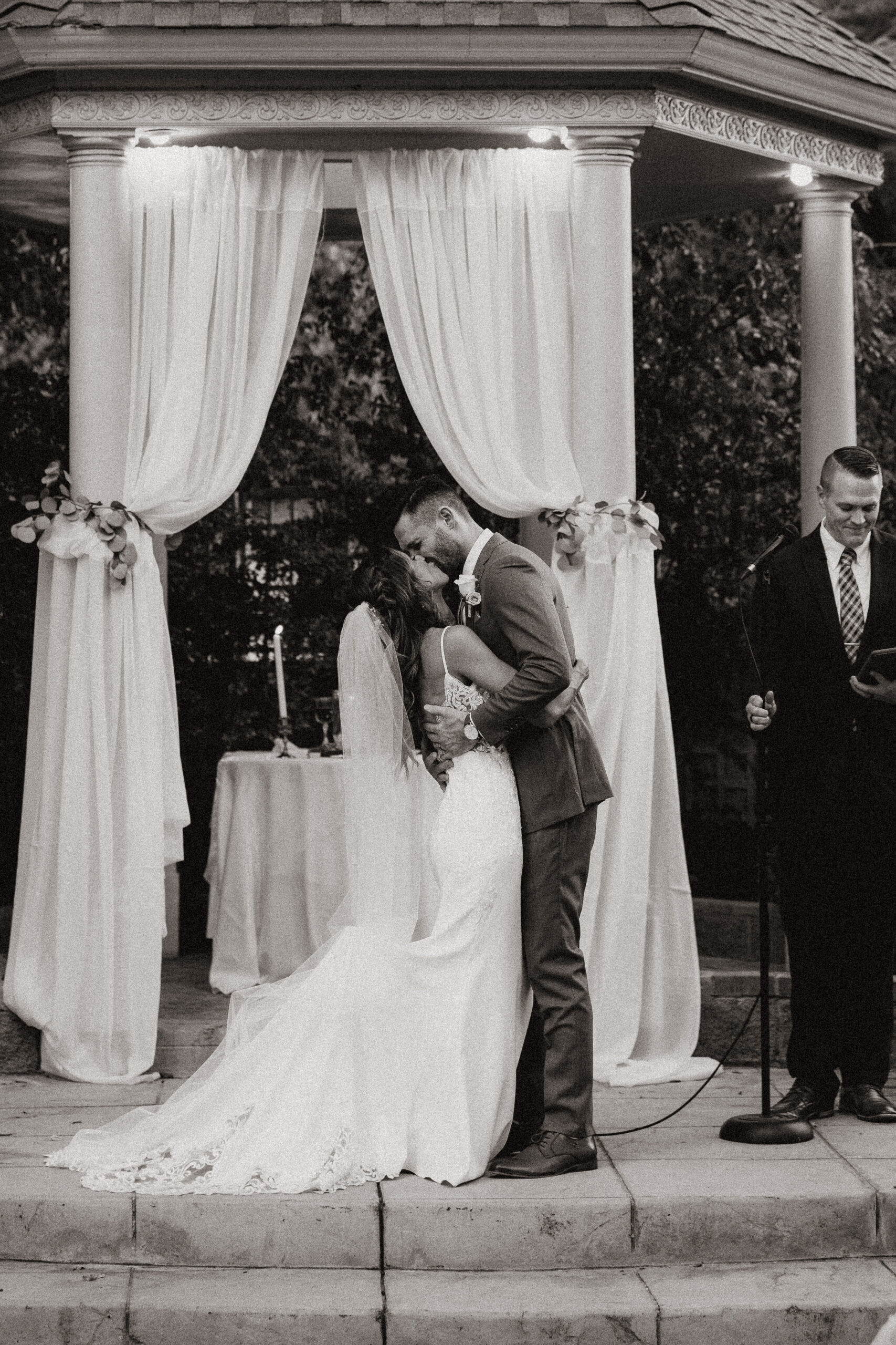 bride and groom kissing at ceremony at garden wedding in arizona 