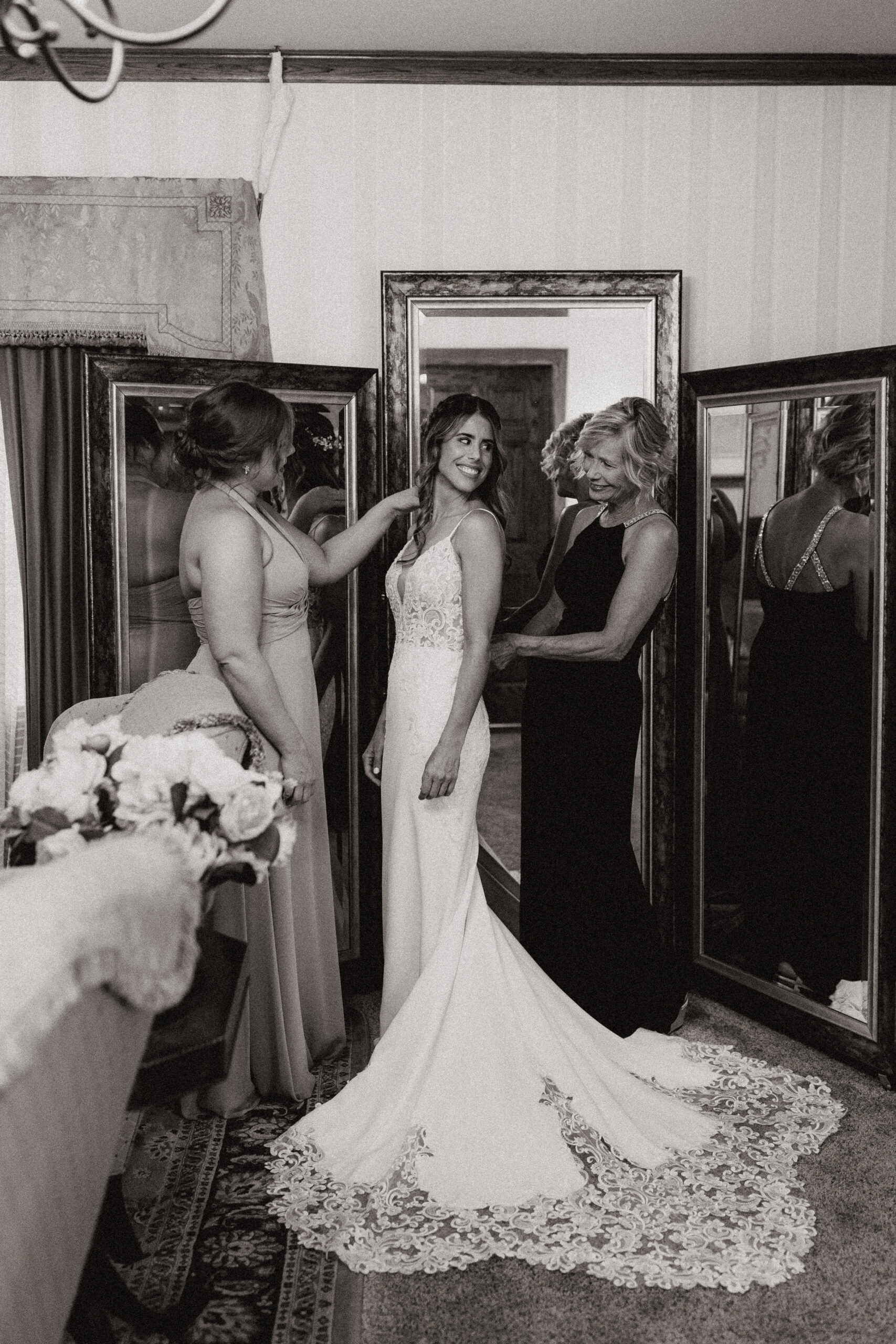 black and white candids of bride and loved ones while she is getting ready for wright house wedding in arizona 