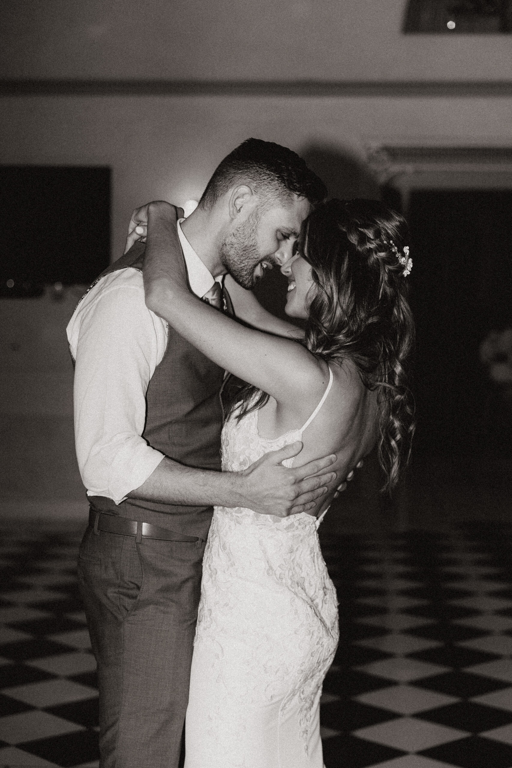 black and white of bride and groom first dance at wright house wedding 
