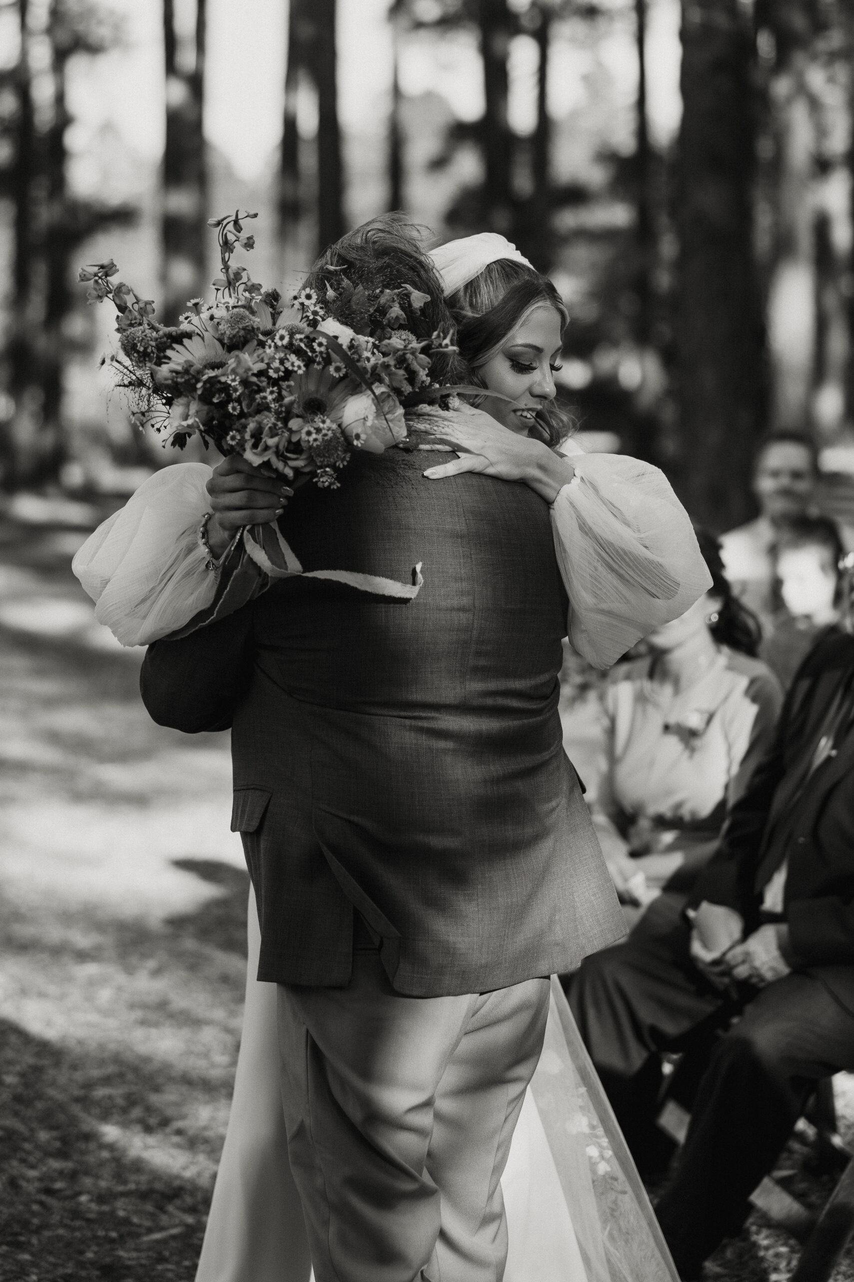 bride hugging father at ceremony 