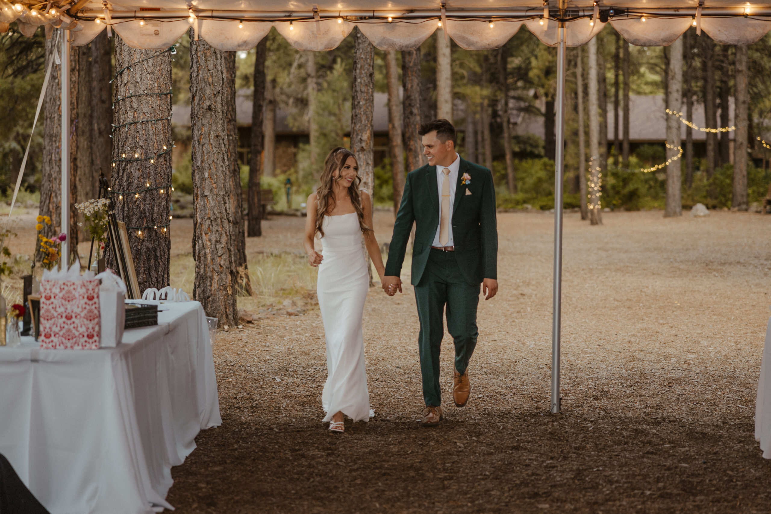bride and groom walking into reception 