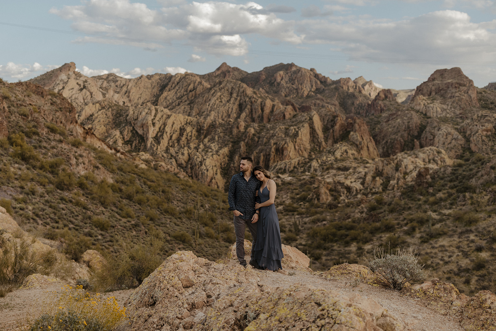 couple with mountains in the background during canyon lake arizona engagement pictures