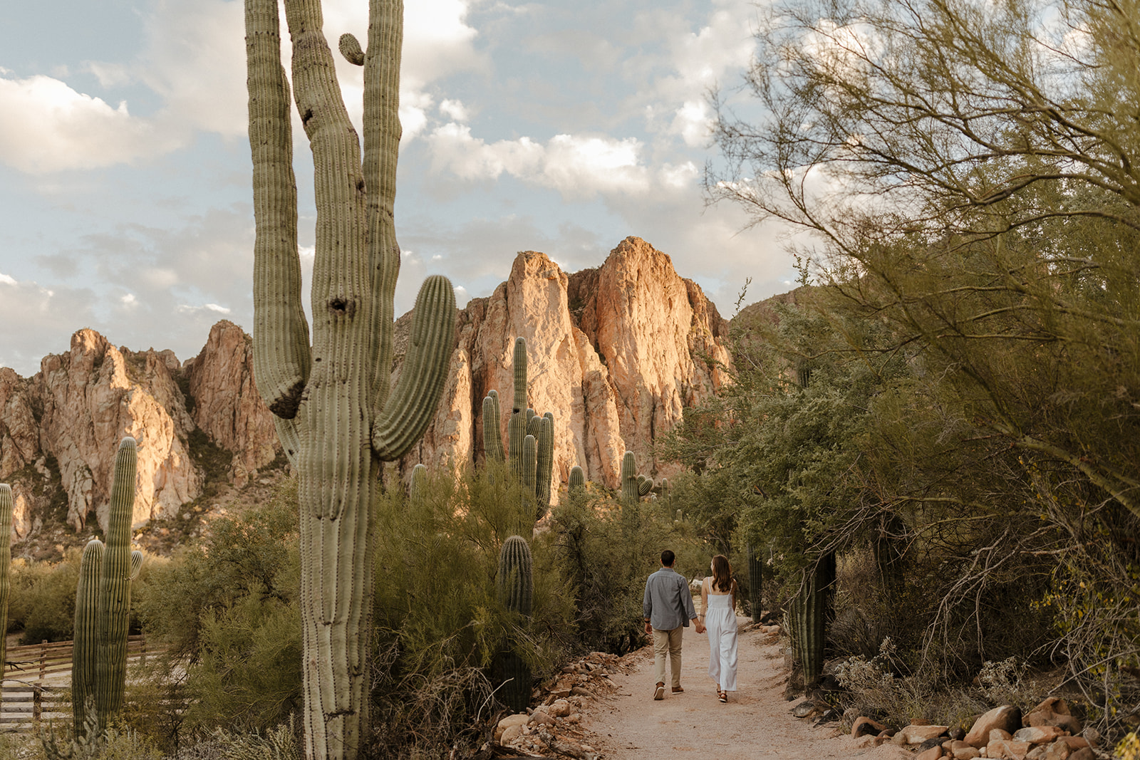 couple walking through the path by the cacti at saguaro lake guest ranch Arizona 