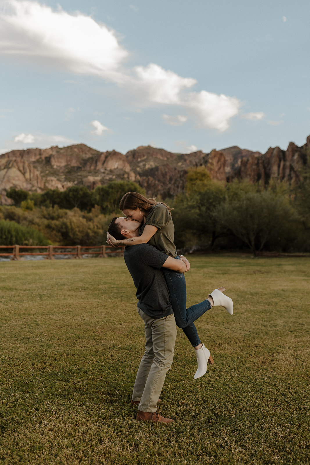 fiance picking up and kissing other fiance at saguaro lake guest ranch Arizona 