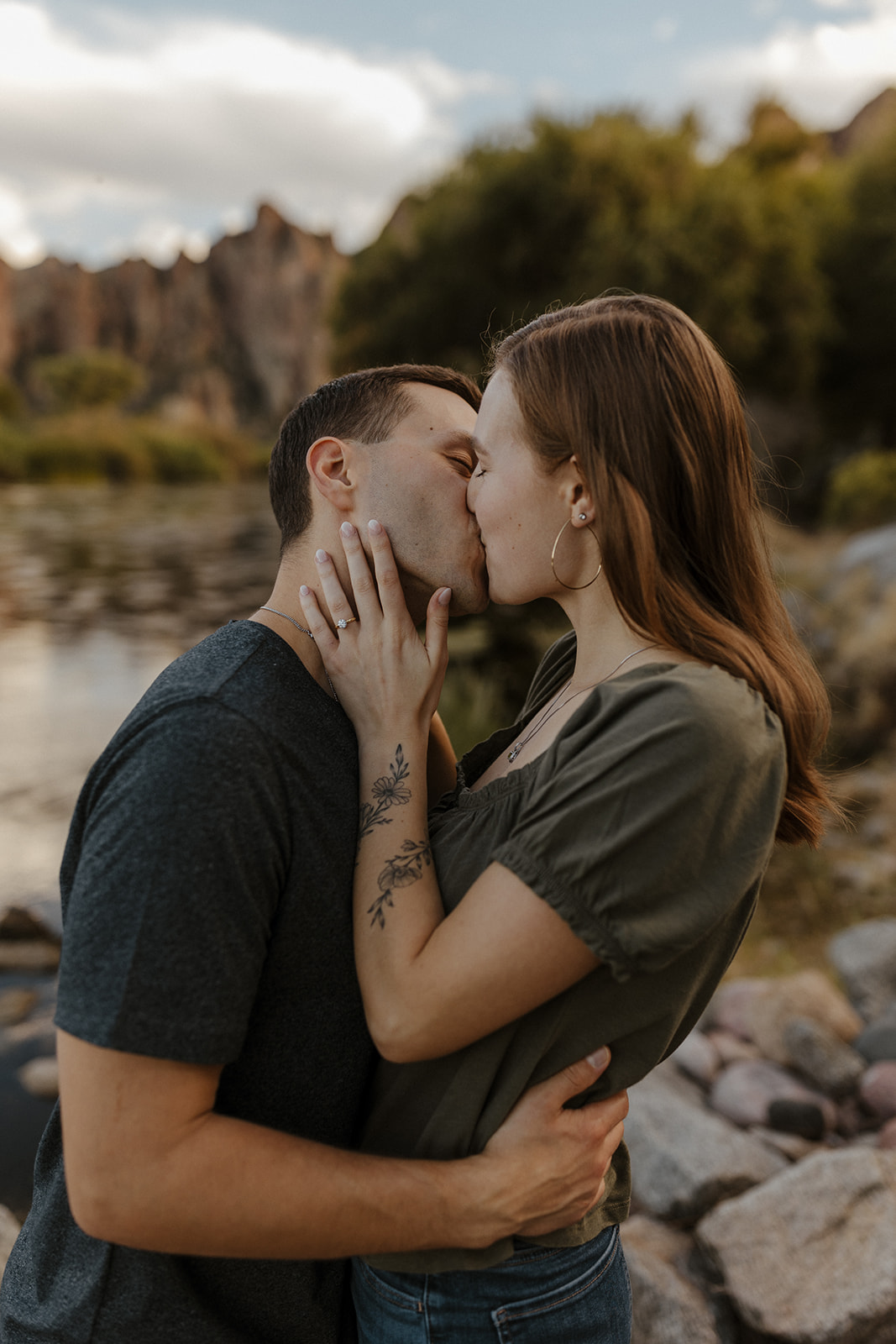 couple kissing by the river at saguaro lake guest ranch Arizona 