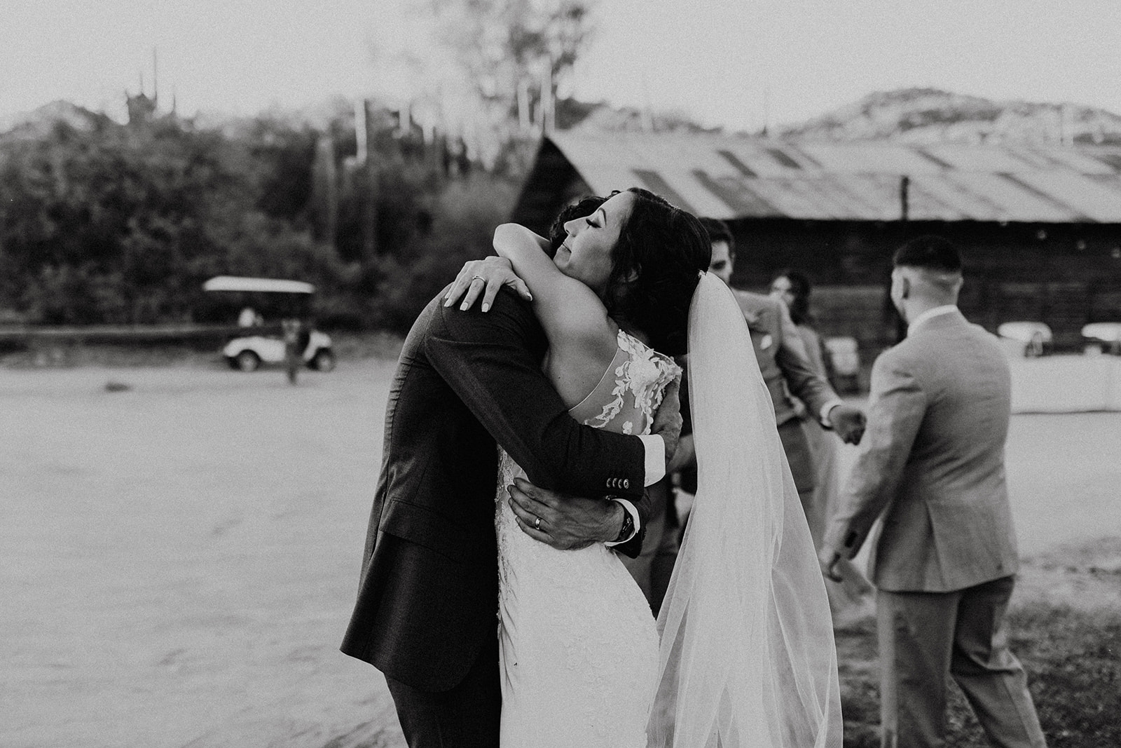 black and white of bride and groom hugging at Saguaro Lake Guest Ranch Wedding