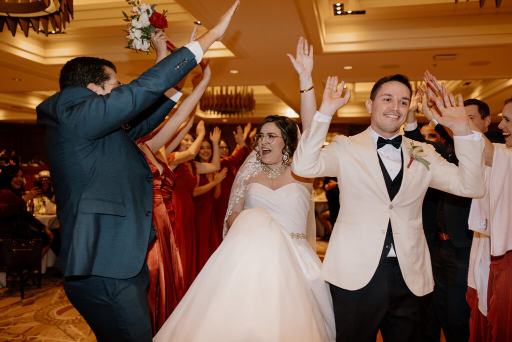 Stunning bride and groom dance with their guests during their Arizona wedding reception