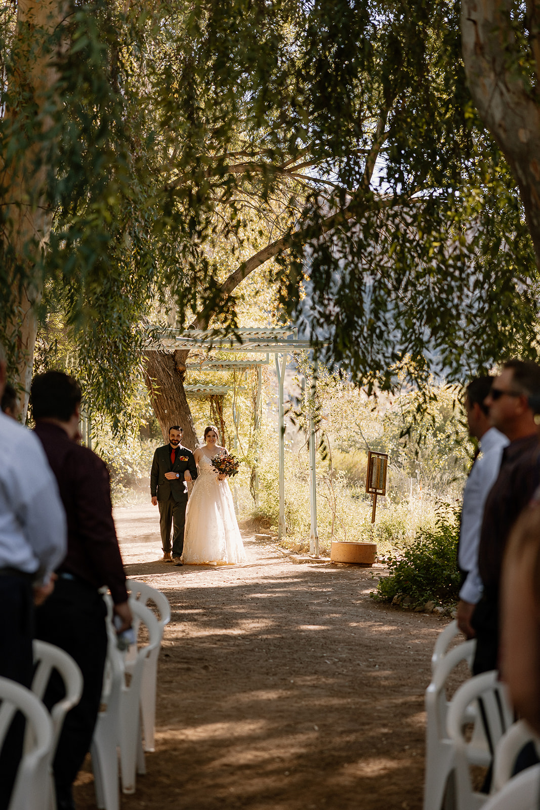 bride walking down the aisle for wedding at boyce thompson arboretum
