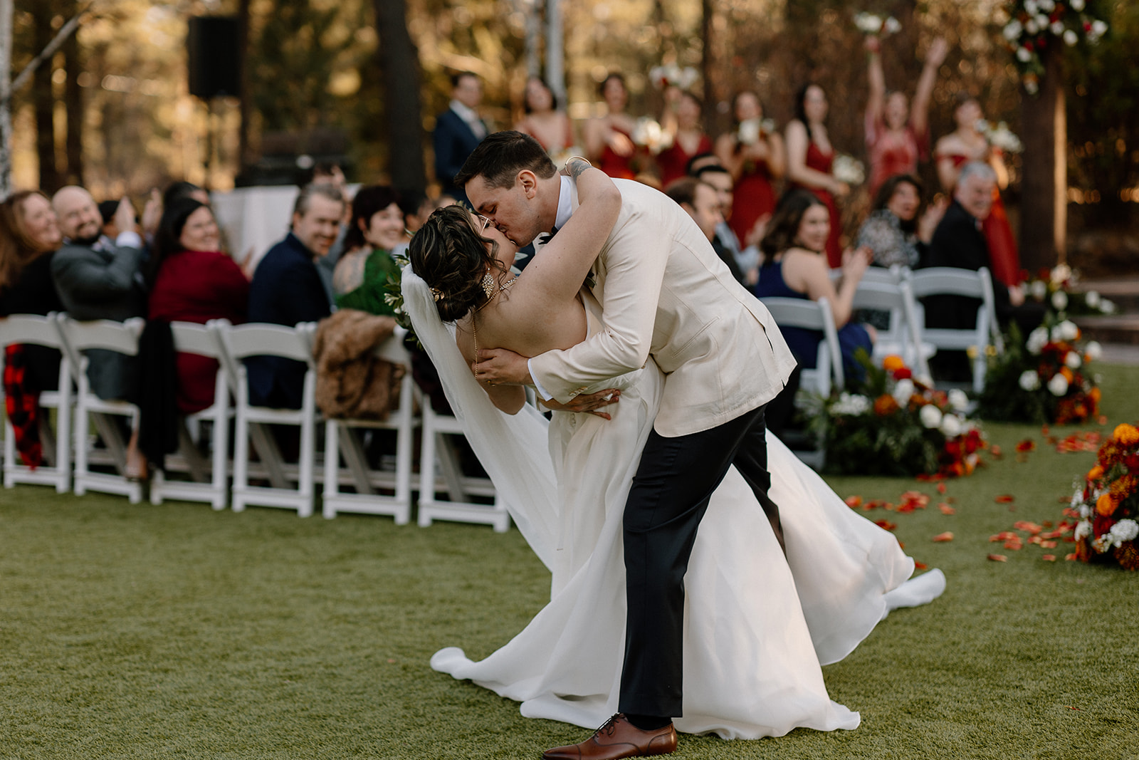 Stunning bride and groom pose kissing together after their dreamy Flag Staff, Arizona wedding