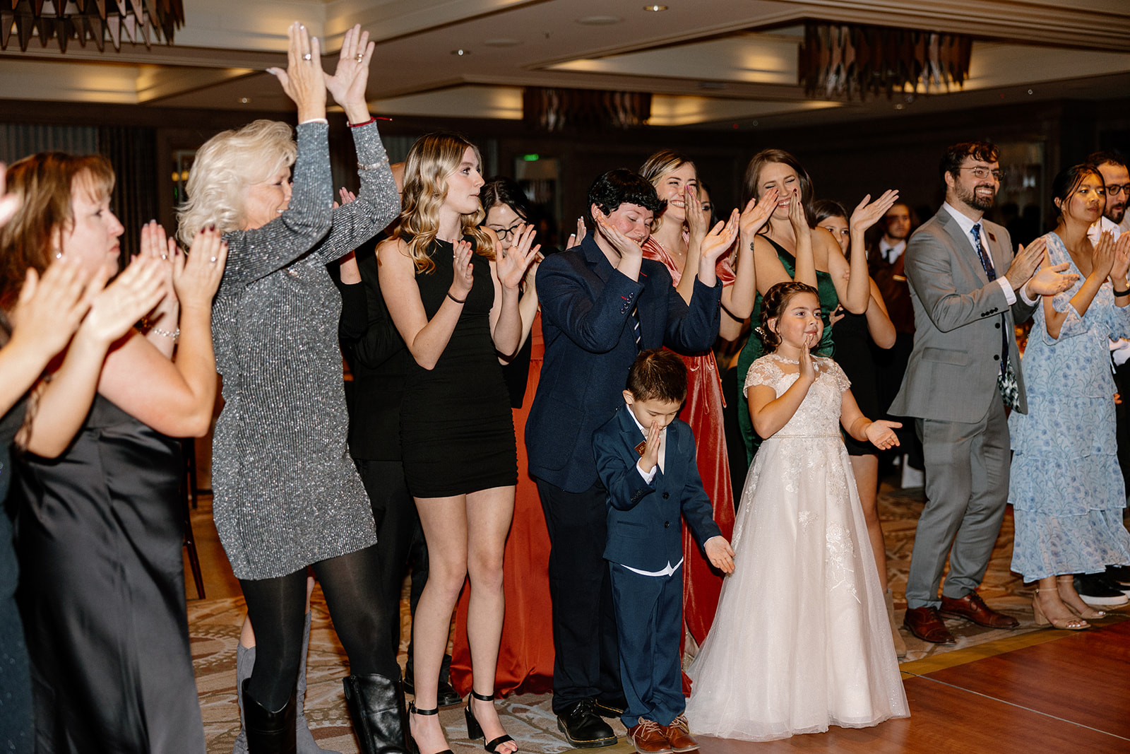 Guests look on and cheer the new bride and groom during their dreamy wedding reception