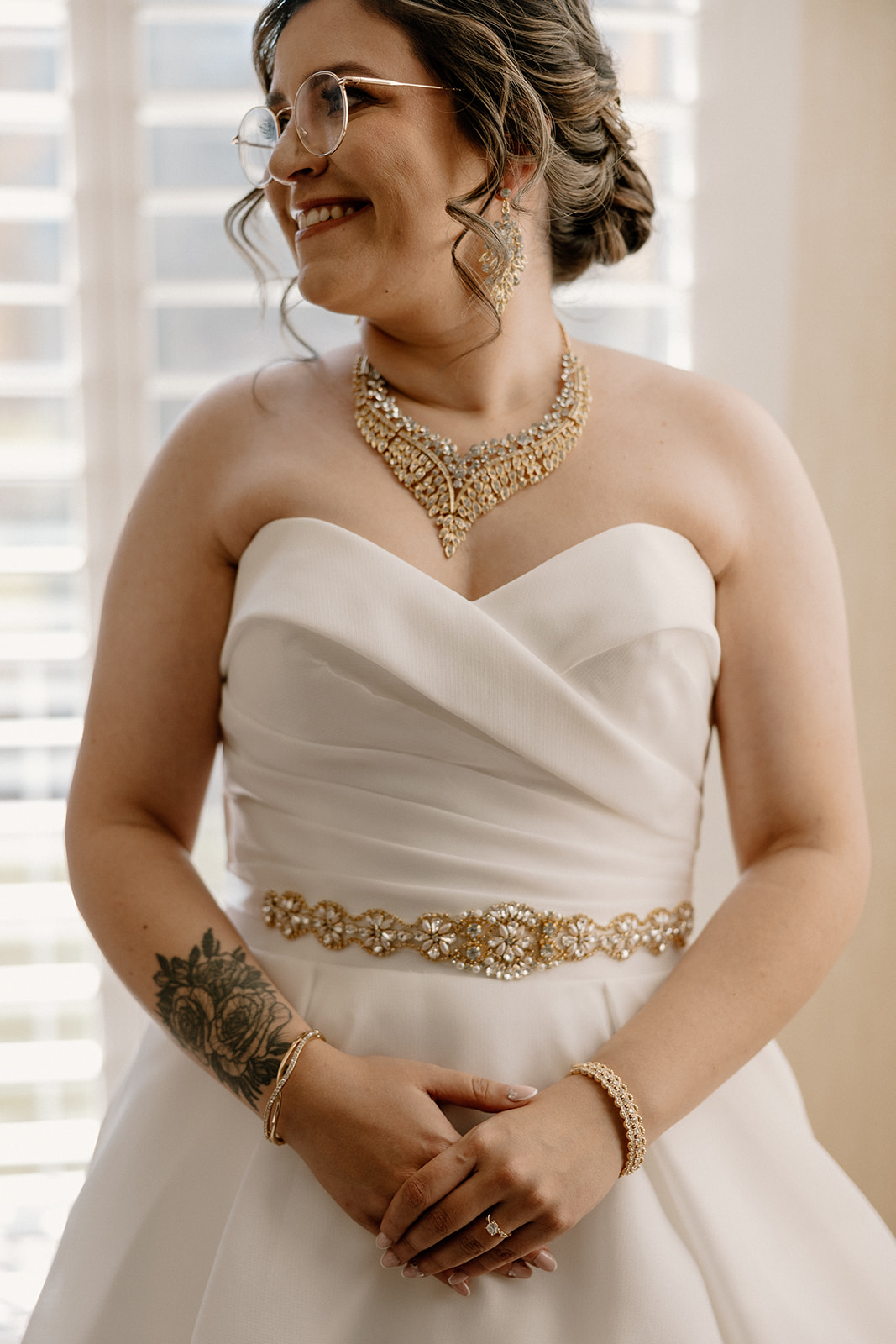 Stunning bride poses as she finalizes her prep 
