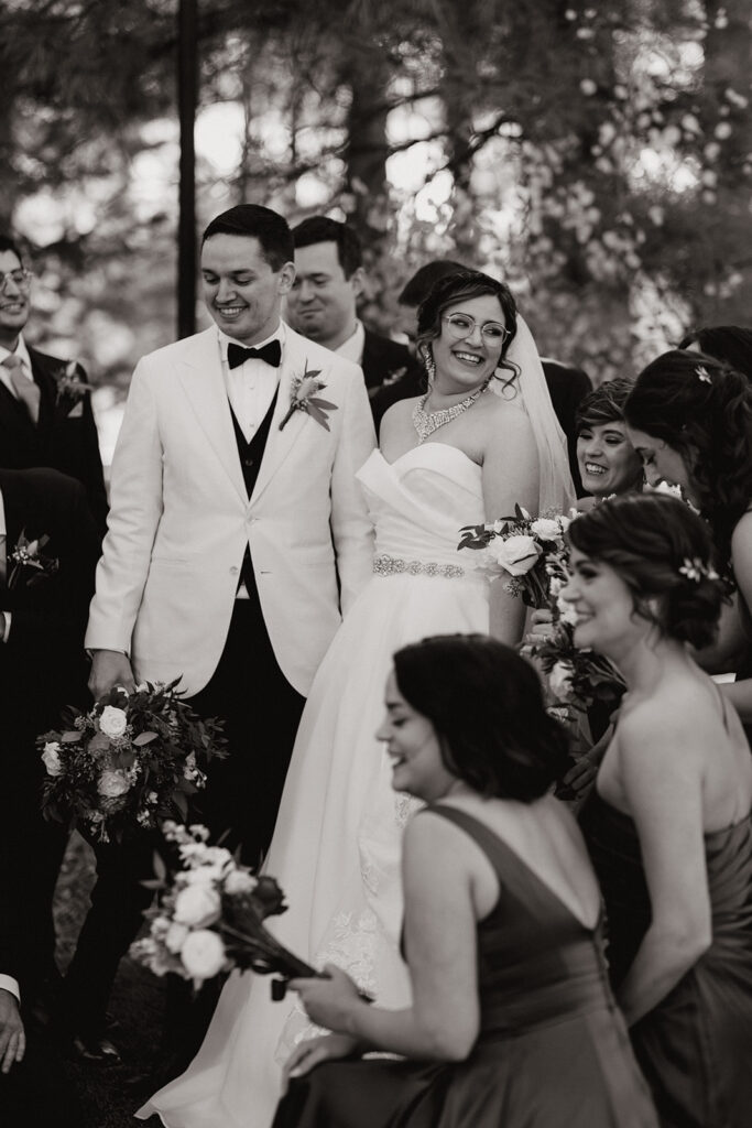 Stunning bride and groom pose together exiting their dreamy Flag Staff, Arizona wedding