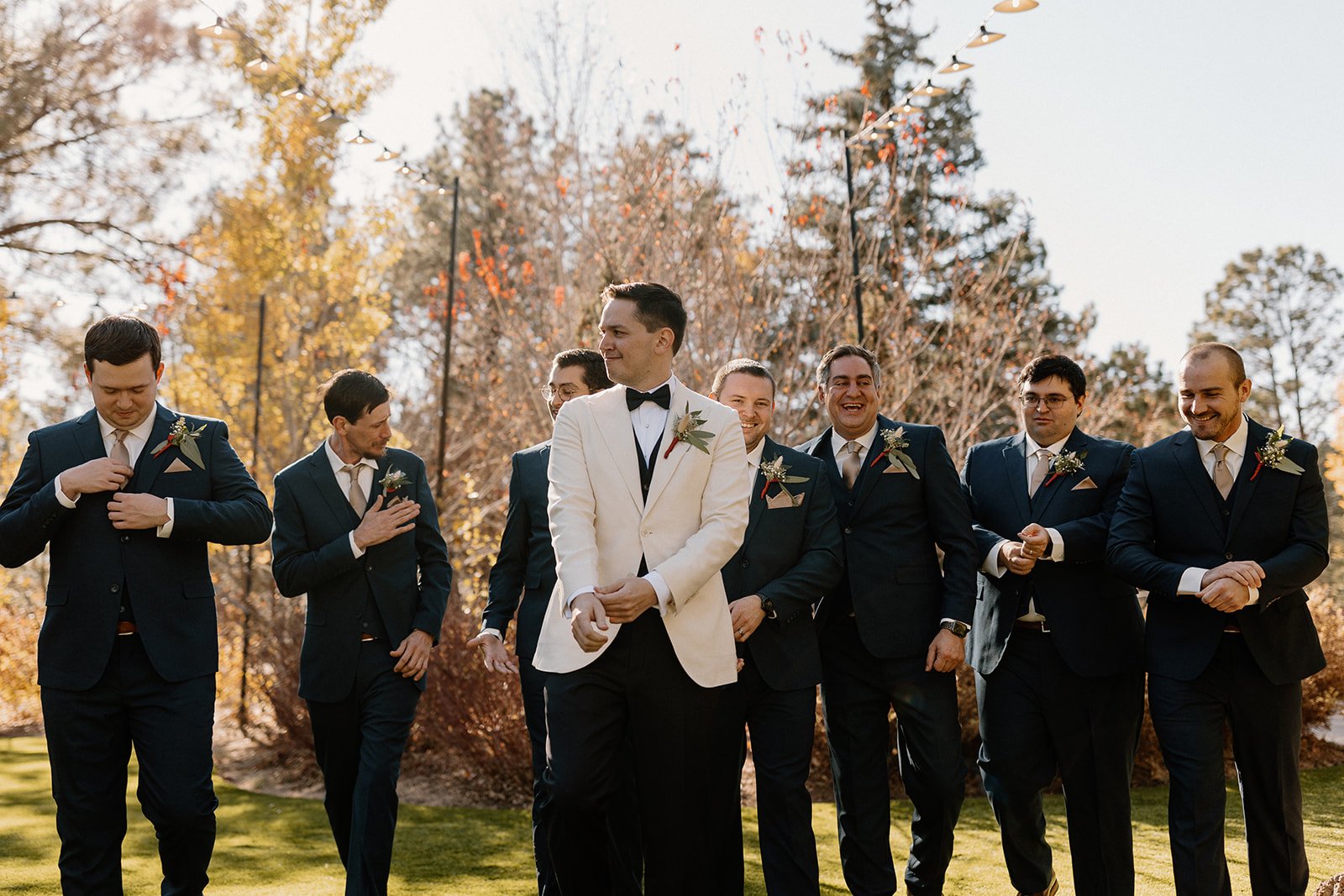 Groom poses with groomsmen before his stunning wedding
