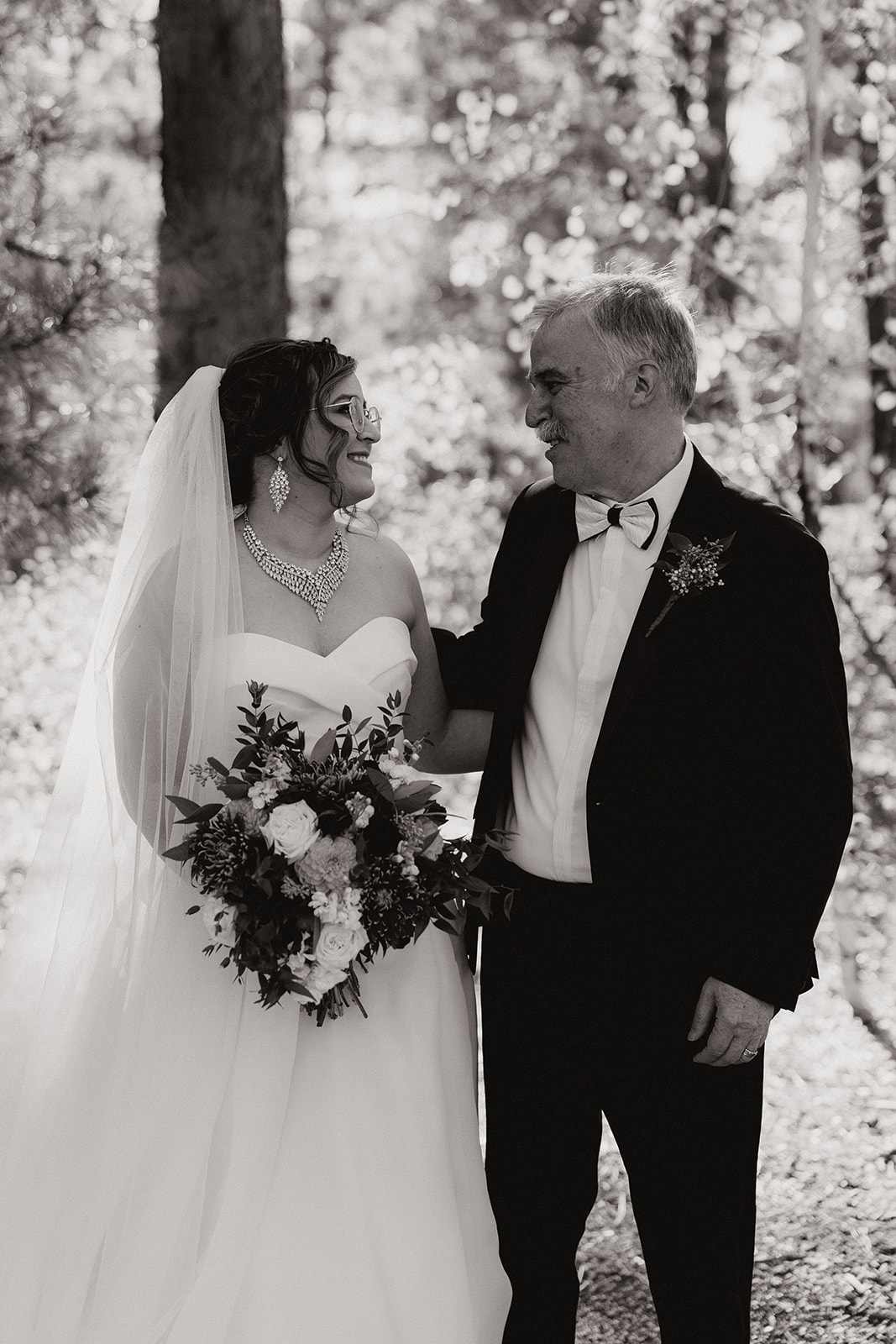 Bride poses with her dad after her dreamy Arizona wedding day!