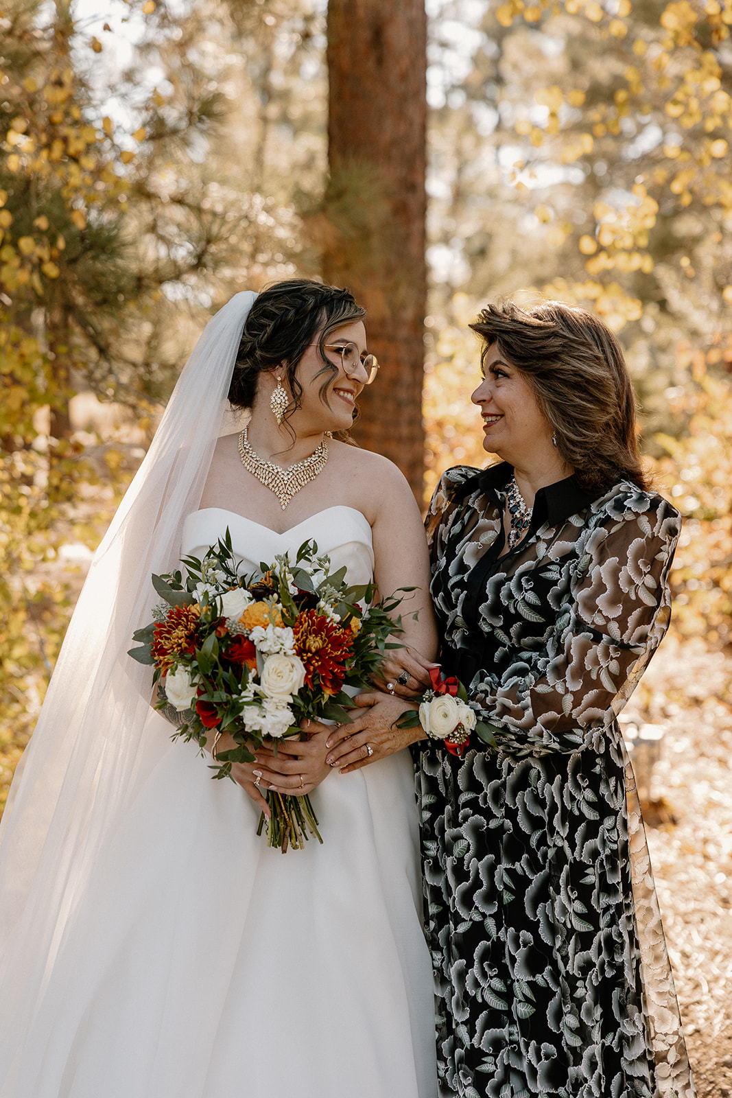 Bride poses with her mom after her dreamy Arizona wedding day!
