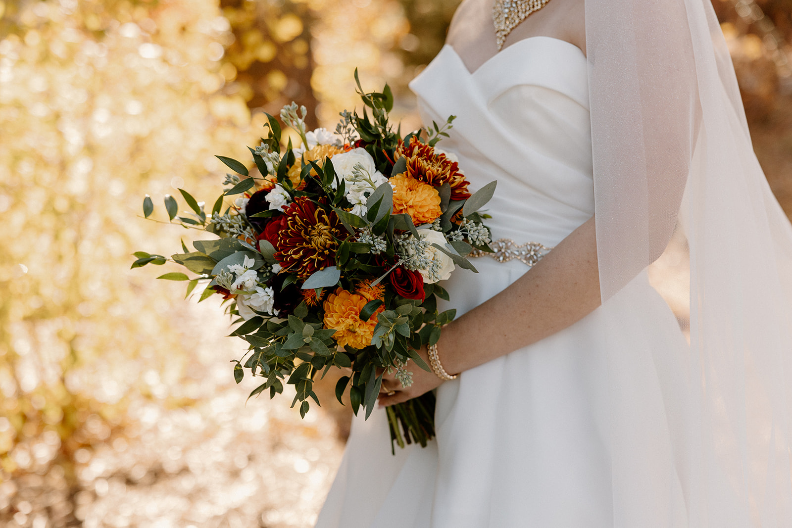 Bride poses with her bouquet during her dreamy Flagstaff wedding
