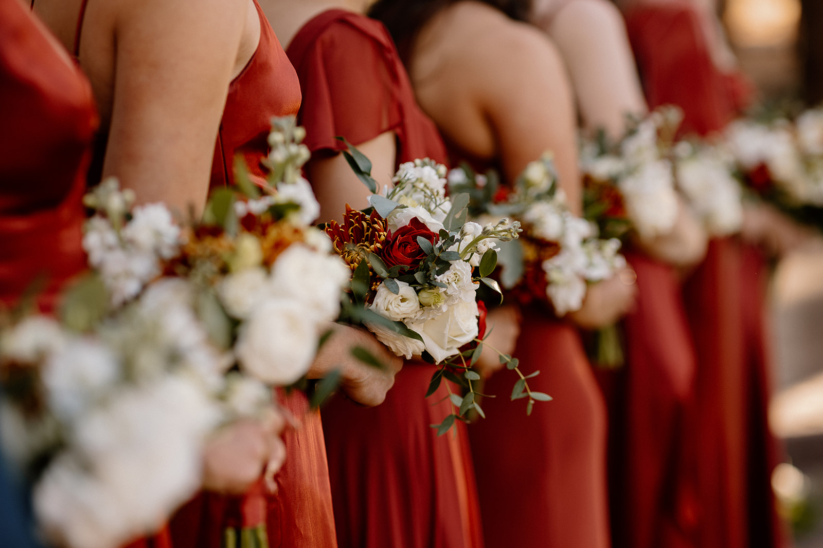 Detail shot of the bridemaids and her bouquet