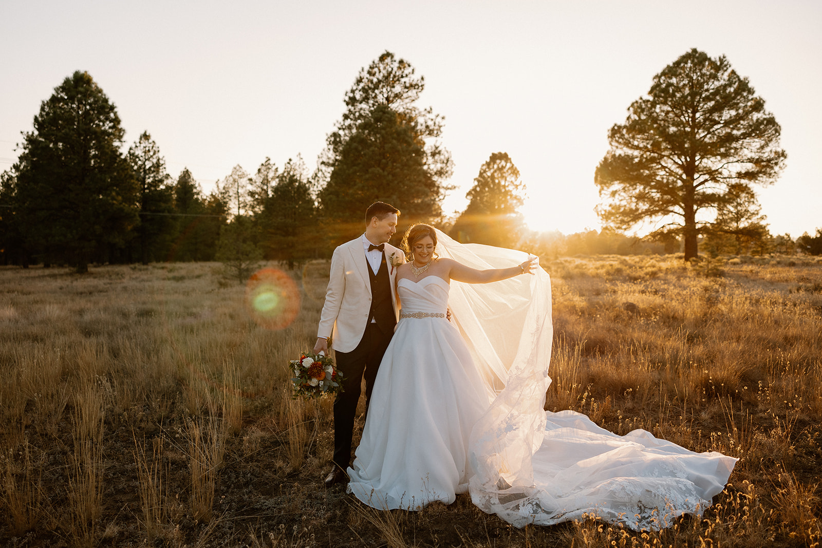 Stunning bride and groom dance together in the Arizona wilderness