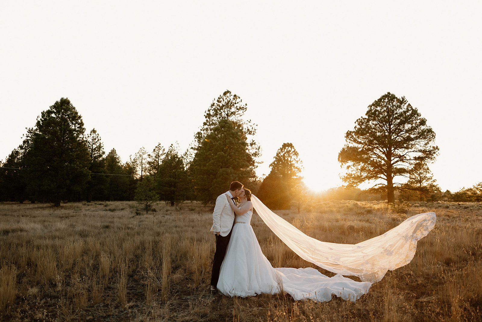 Stunning bride and groom dance together in the Arizona wilderness