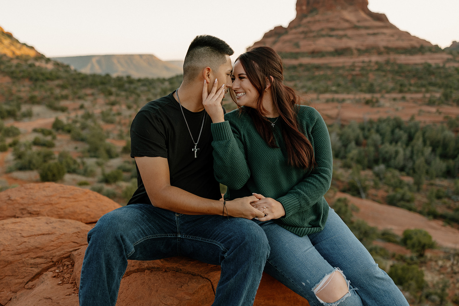 Beautiful couple shares a romantic moment during their dreamy west fork trail in Sedona Arizona engagement photoshoot 